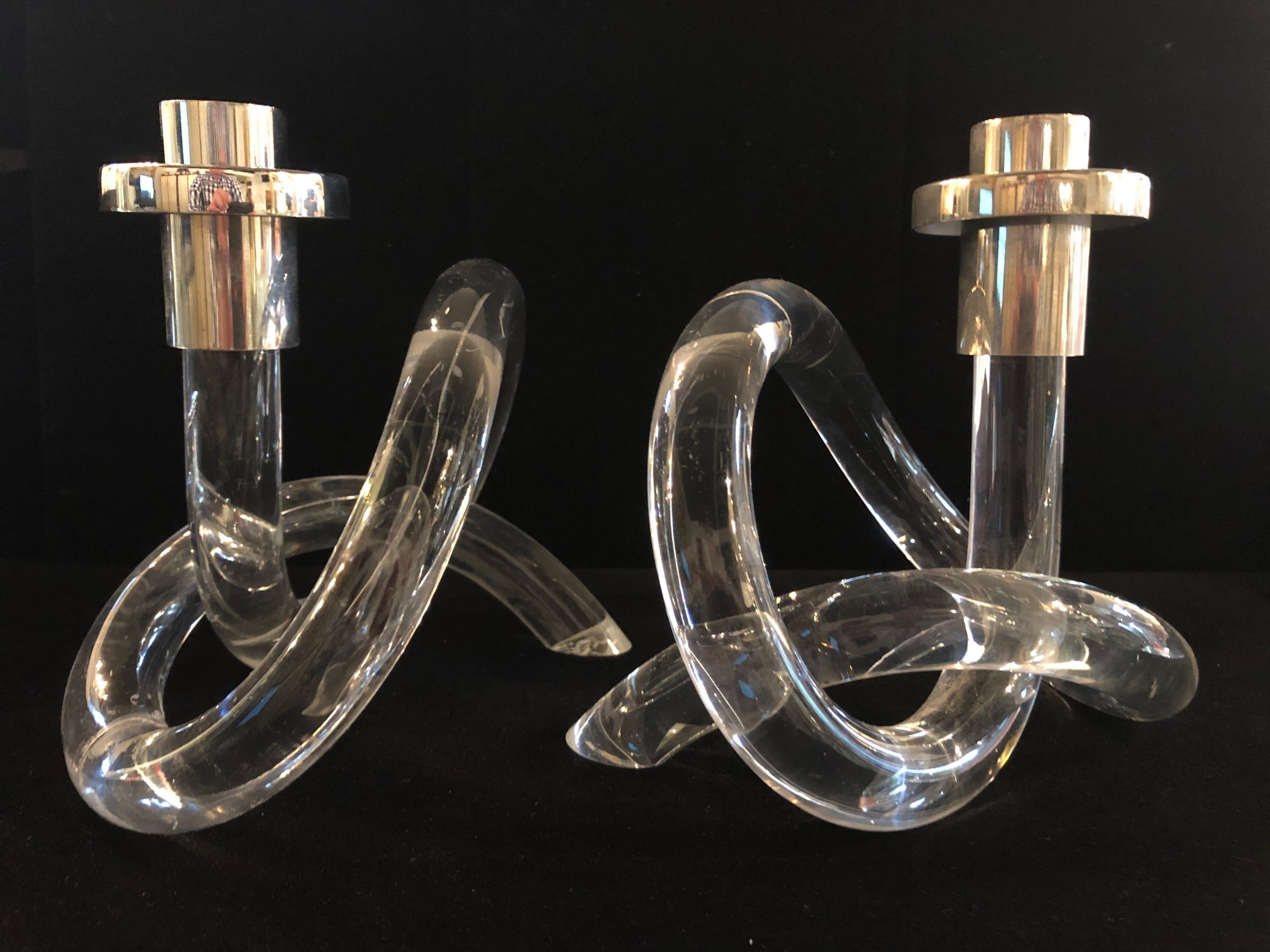 Pair of Dorothy Thorpe twisted Lucite and chrome candlesticks 
In original condition. Slight imperfection interior line in Lucite, shown last two images.