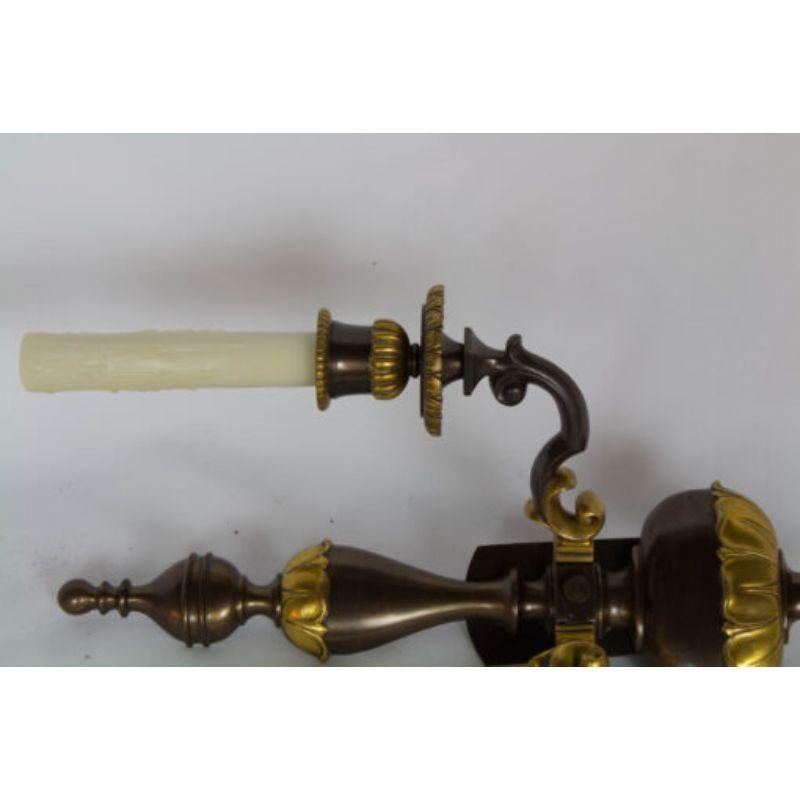 Pair of double arm two toned sconces. Gilt bronze and dark patina on bronze. American, C. 1915 Completely restored and rewired. Ready to install.

Dimensions: 
Width: 11?
Depth: 5.5?
Height: 18?.