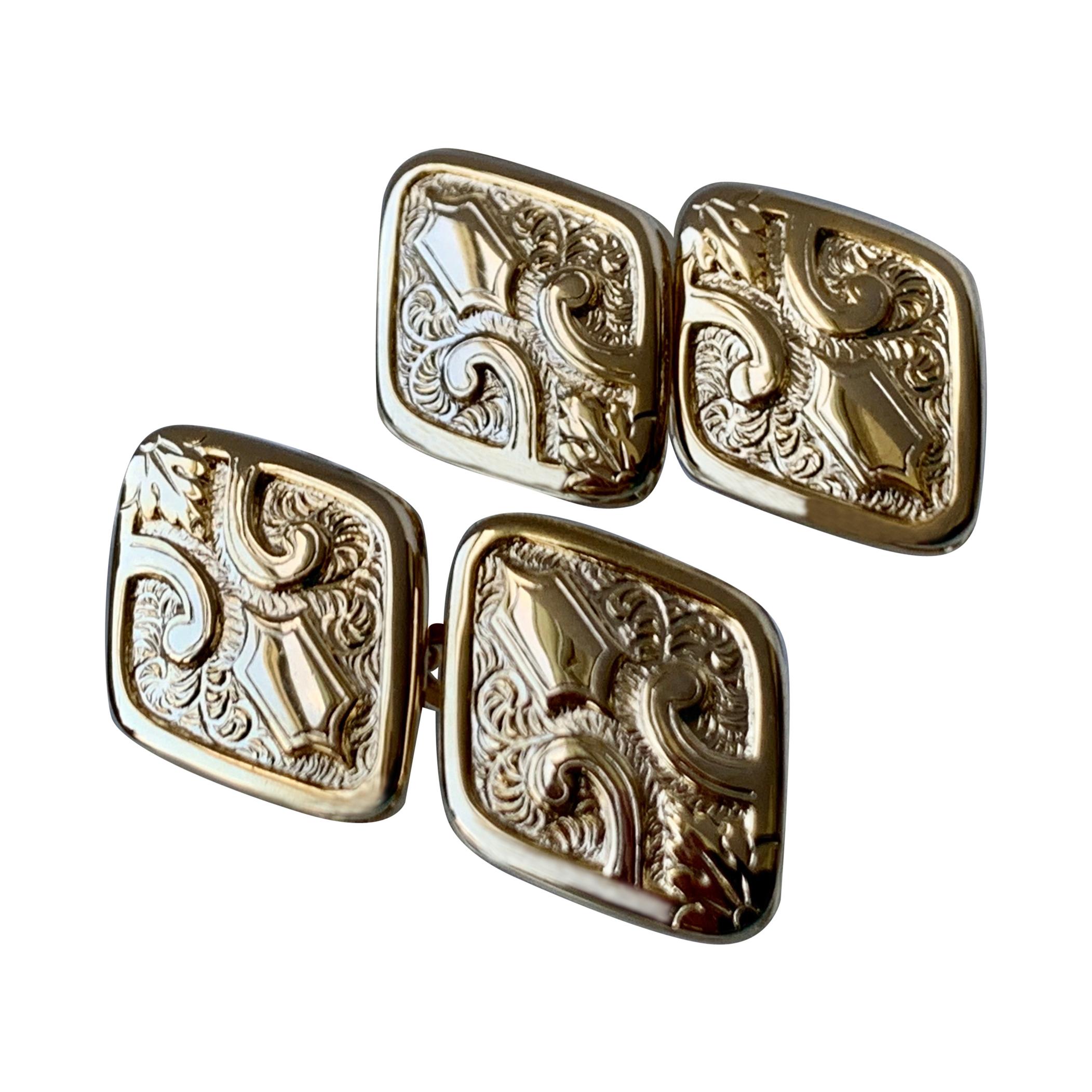 Pair of vintage gold filled double diamond shaped cufflinks with raised design.  The diamond shaped cufflinks are connected by a short chain.  This pair of links are traditional, very elegant in their simplicity and yet quite contemporary.  They