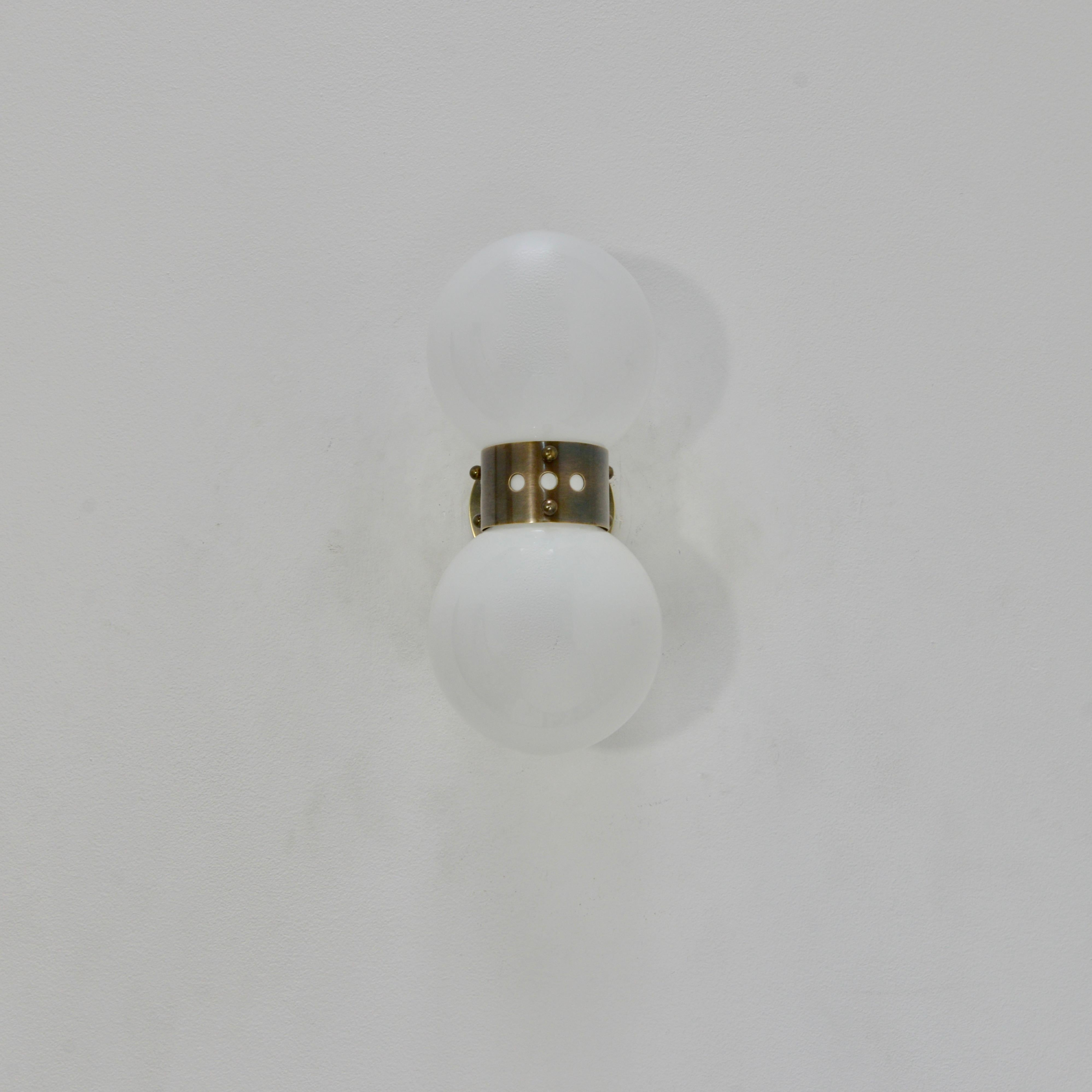 Classic double shaded glass and darkened brass sconces attributed to Mazzega from mid 20th century, Italy. A Classic stunning look with an effective design that feels contemporary. Wired with two E12 candelabra based sockets per sconce, for use in