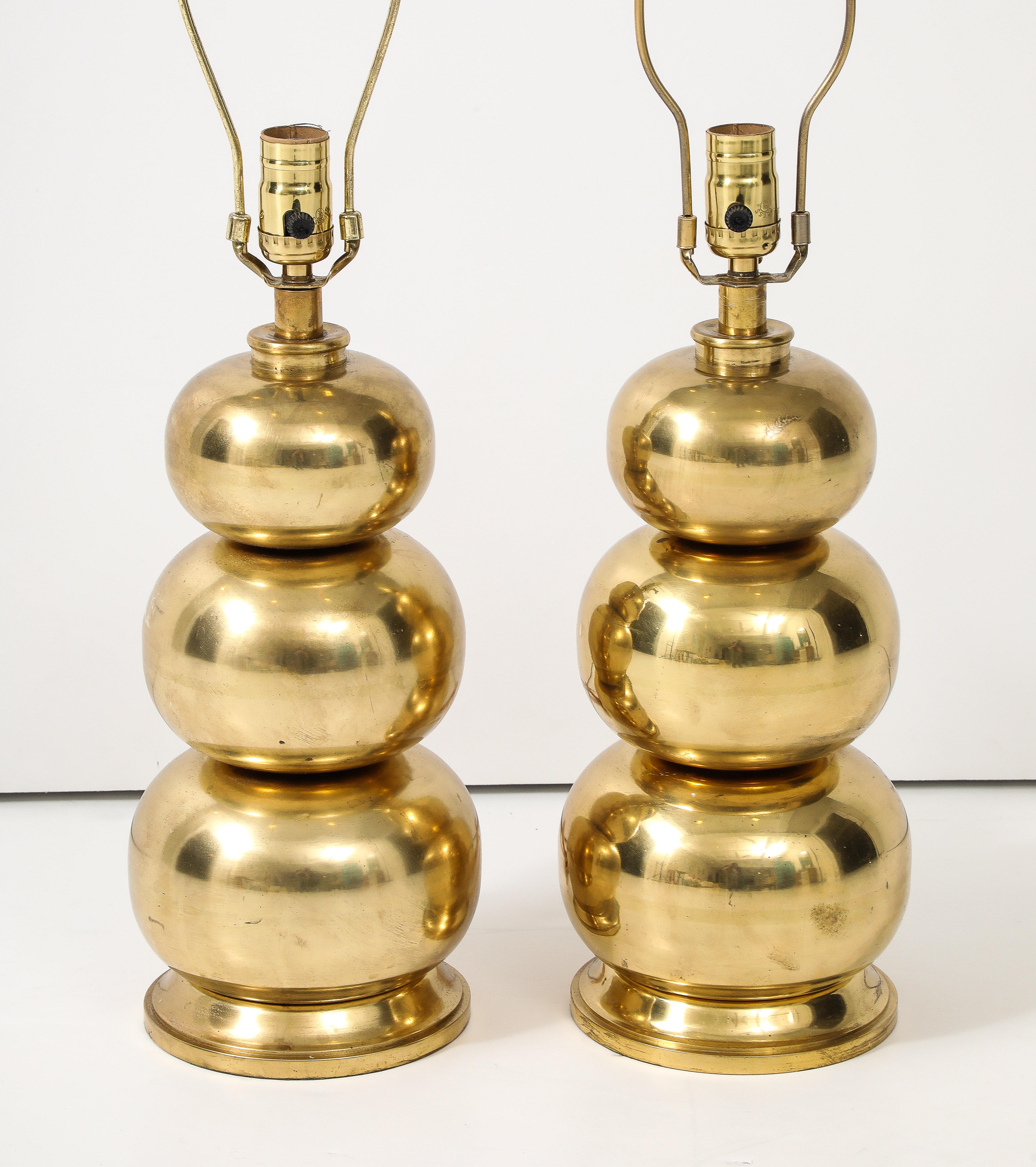 A pair of triple gourd brass lamps,  newly re-wired and ready to go.  These beauties will add a bit of weight and shine to any space.