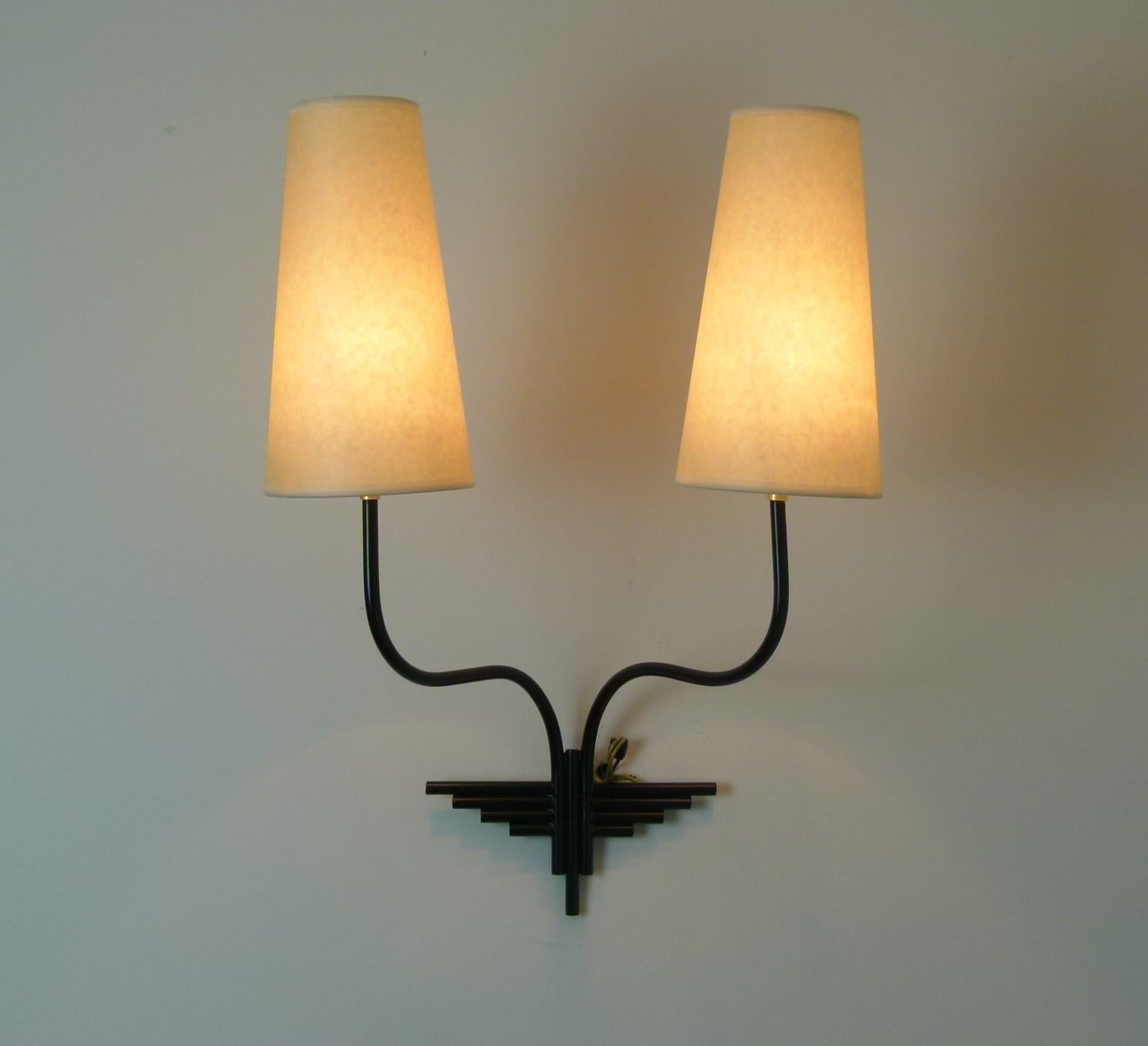 Pair of double sconce, in black lacquered metal.
The electricity has been redone to EU standards.
The shades are redone according to the original model.
Adapters for American bulbs will be provided.
French work circa 1950.
Perfect condition.
 