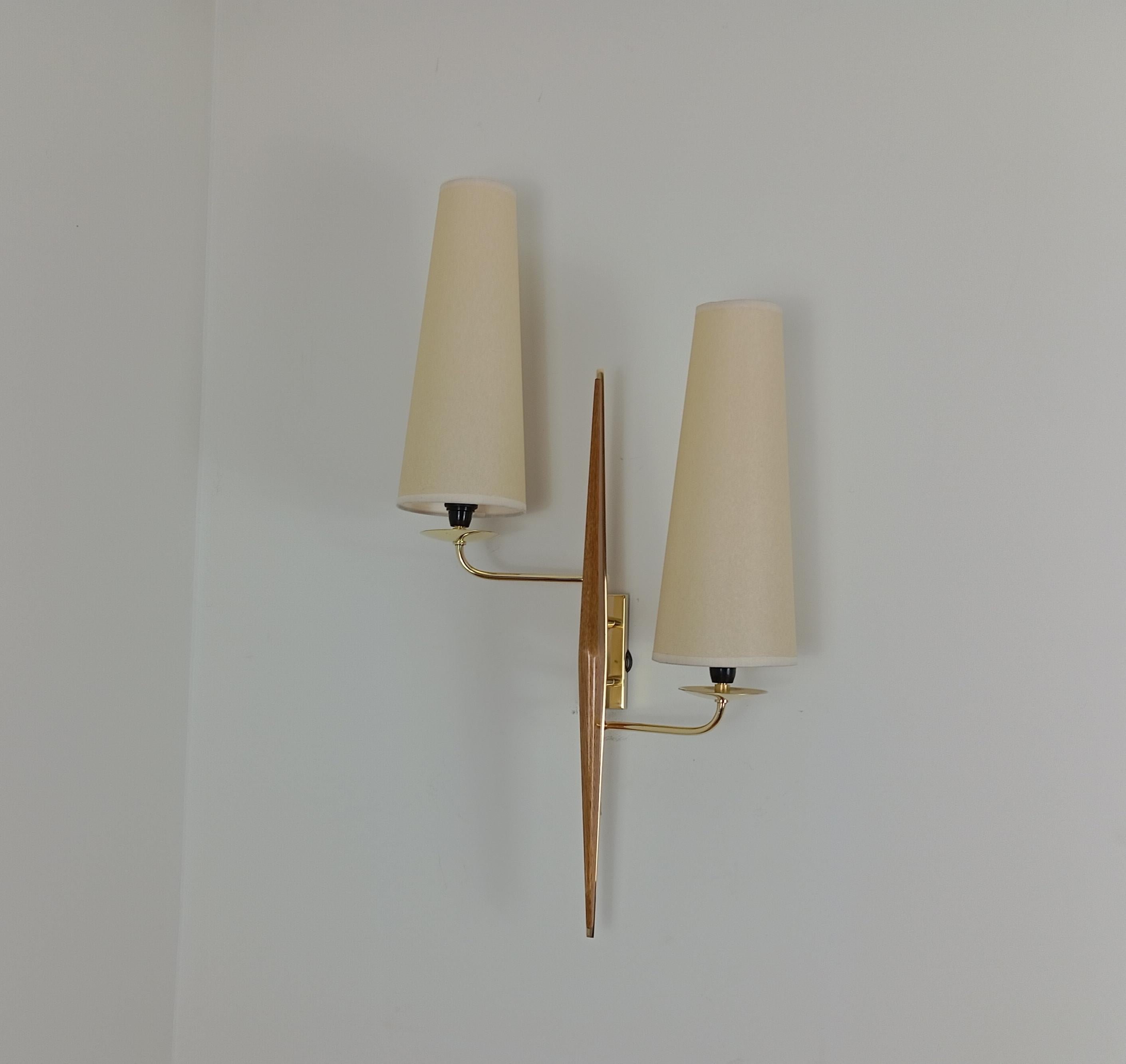 Pair of double sconces in brass and teak wood, Maison Lunel circa 1950 5