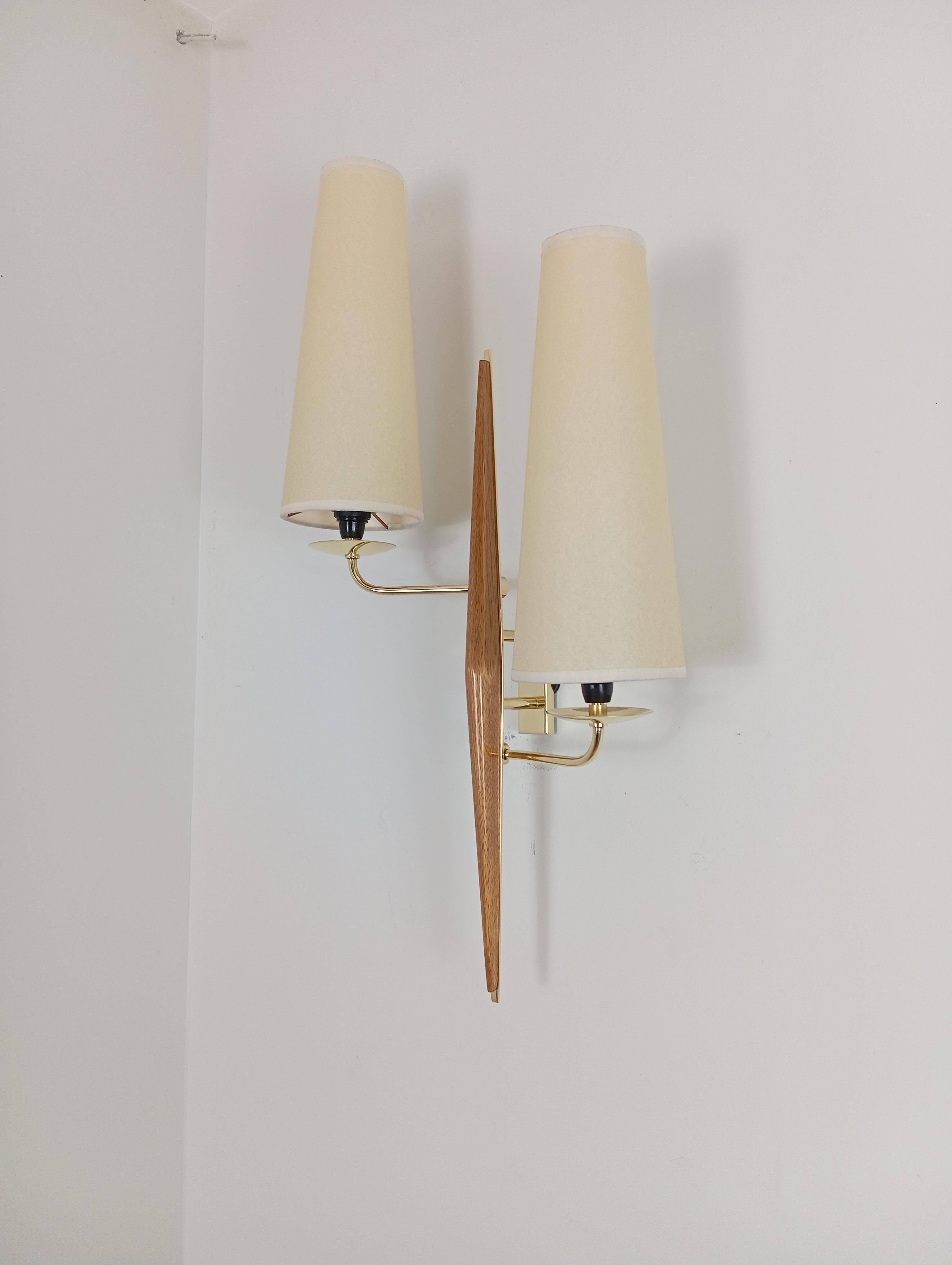 Pair of double sconces in brass and teak wood, Maison Lunel circa 1950 11