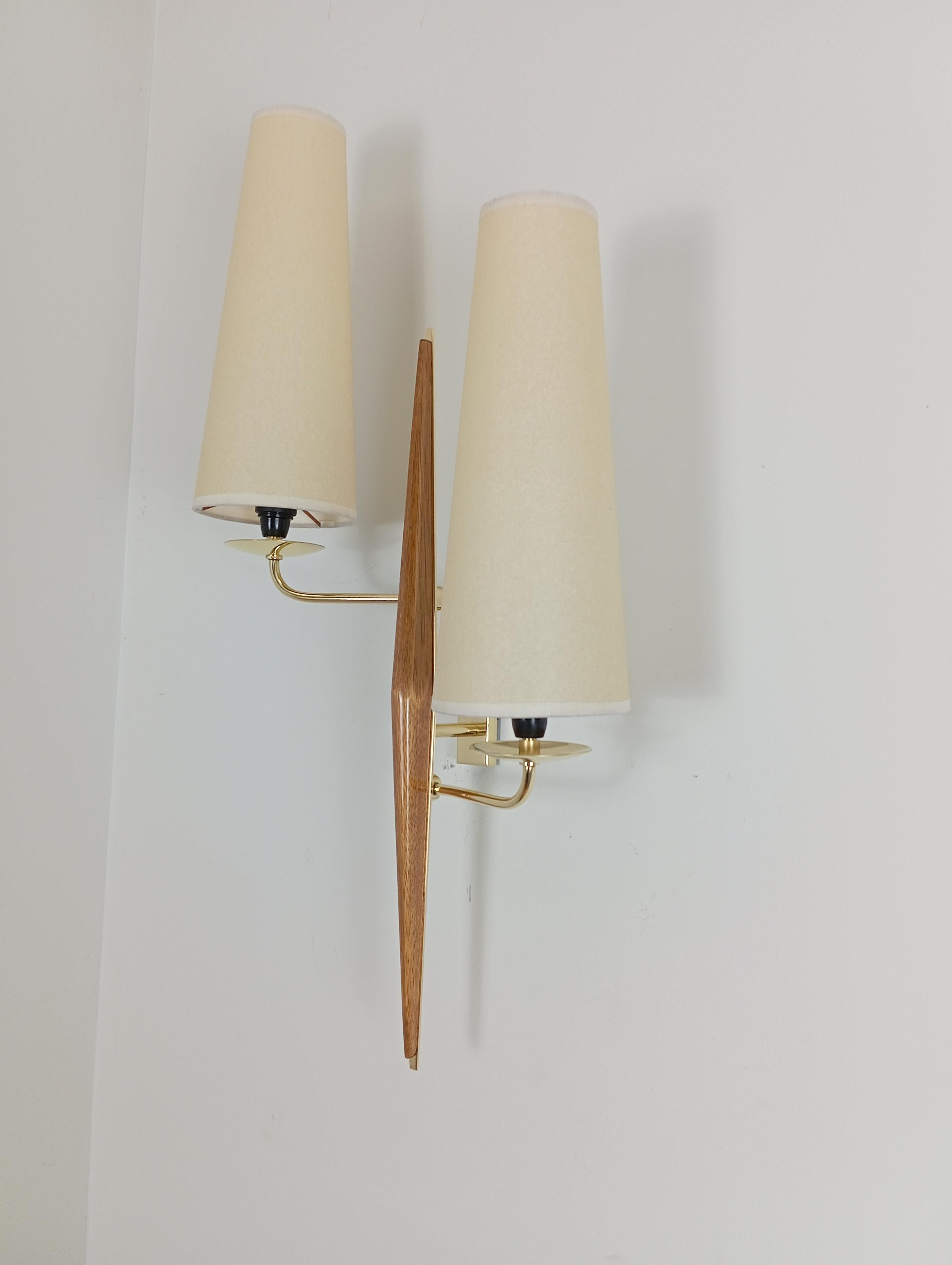 French Pair of double sconces in brass and teak wood, Maison Lunel circa 1950