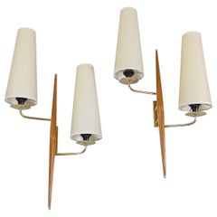 Pair of double sconces in brass and teak wood, Maison Lunel circa 1950