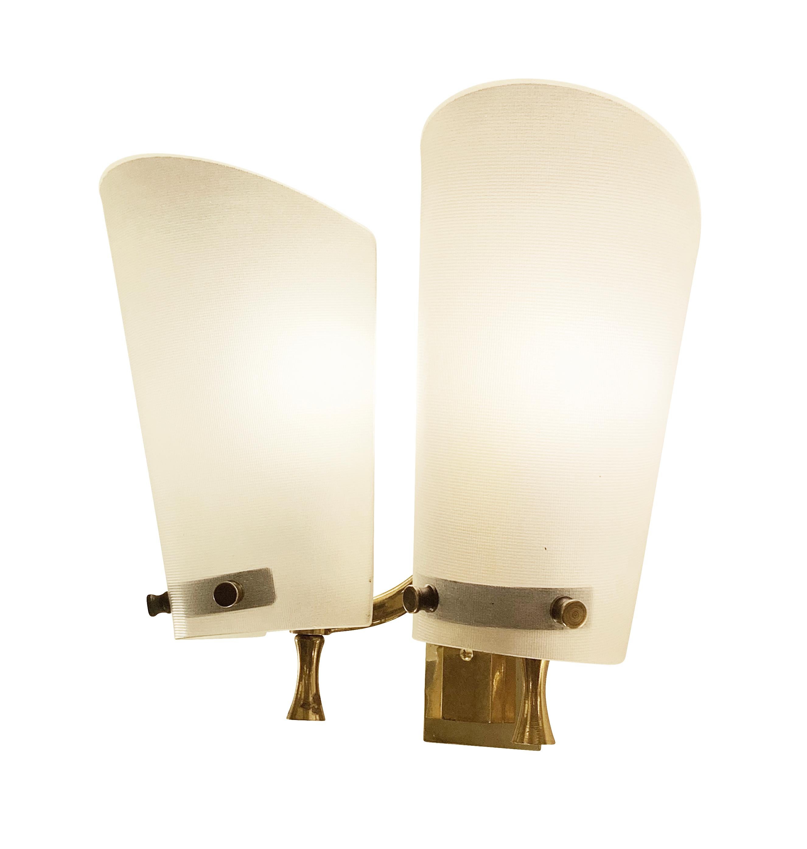 Pair of Italian Mid-Century wall lights each with two textured glass shades on a cast brass frame.

Condition: Excellent vintage condition, minor wear consistent with age and use.

Height: 9”

Width: 10”

Depth: 5.5”

Ref#: LTZ2002