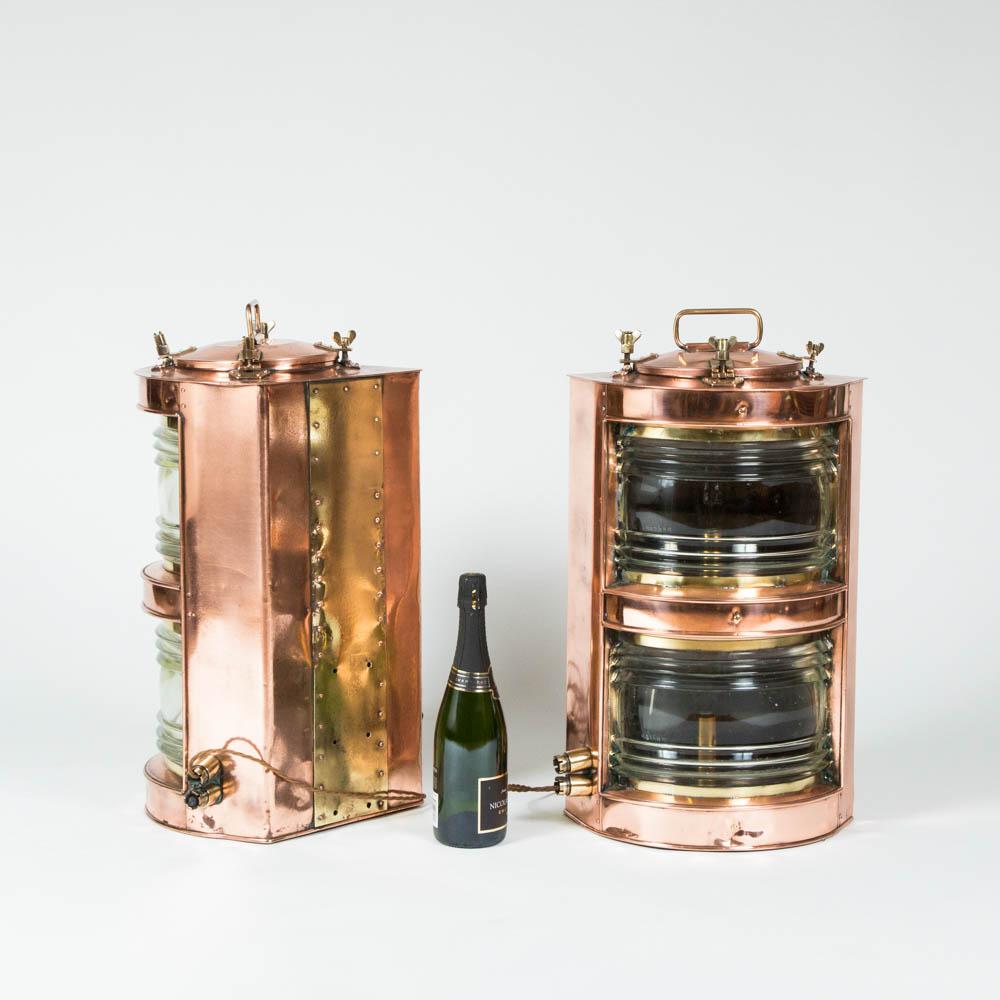 A pair of double-stack copper ships lights, port and starboard. 

Each fitted with two Fresnel lenses, each lens marked with triple G monograph. 

Wired for mains electricity.