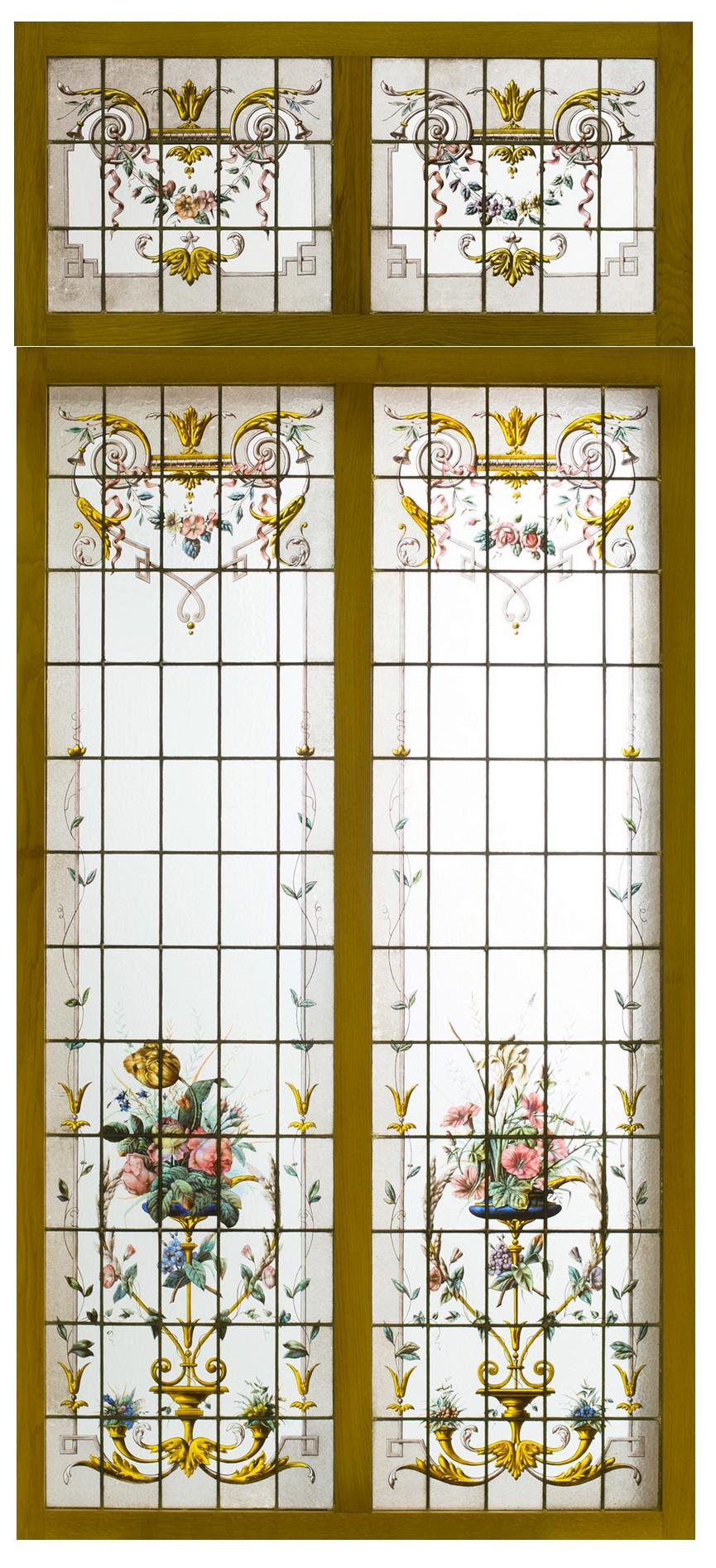 Pair of double stained glass windows and their transoms painted in grey and enamel on translucent glass representing bouquets of flowers framed with friezes of plants and flowers.
French work, circa 1880.

Transom dimensions with frame:
Height 24.41