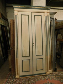 Pair of double wing doors, lacquered and gilded with frame, Italy