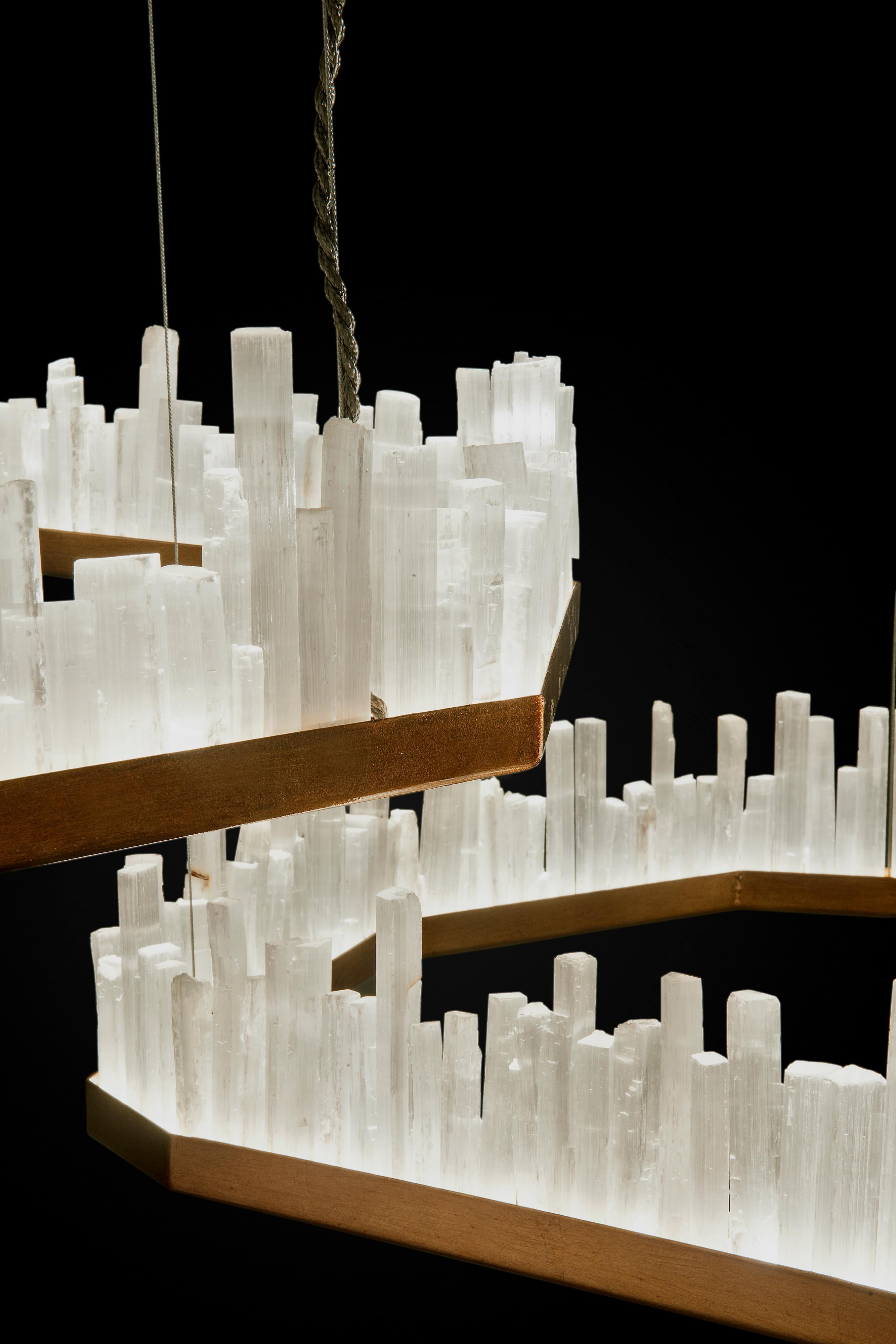 Pair of Downtowns, Natural Selenite Pendant Lamps
Dimensions: 81 x 81 x 18 cm
Lighting: One led 28W / 1800 Lumens
Finish: Silver leaf, old silver leaf, gold leaf, old gold leaf, copper leaf, rusty, pink golf and brass.
Natural Selenite Stone