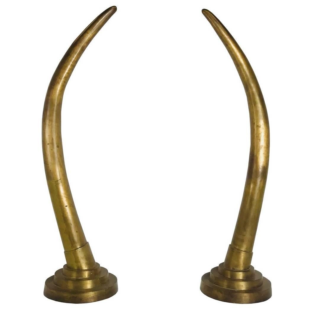 Pair of Dramatic Life-Size Brass Tusk Statues