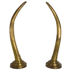 Pair of Dramatic Life-Size Brass Tusk Statues