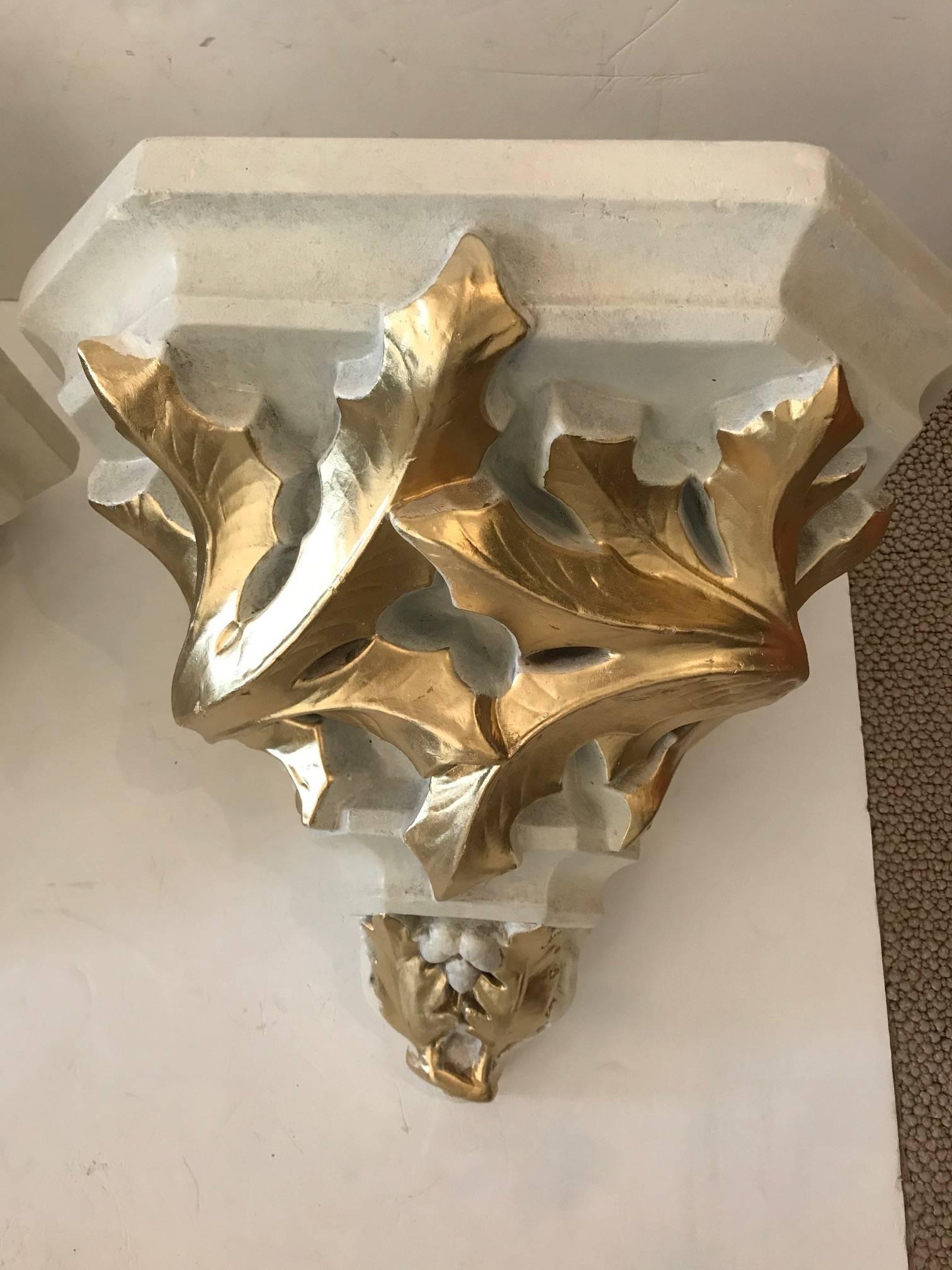 Pair of cream and gold very large French terracotta and plaster wall brackets having
acorn and leaf motif in relief.
 
