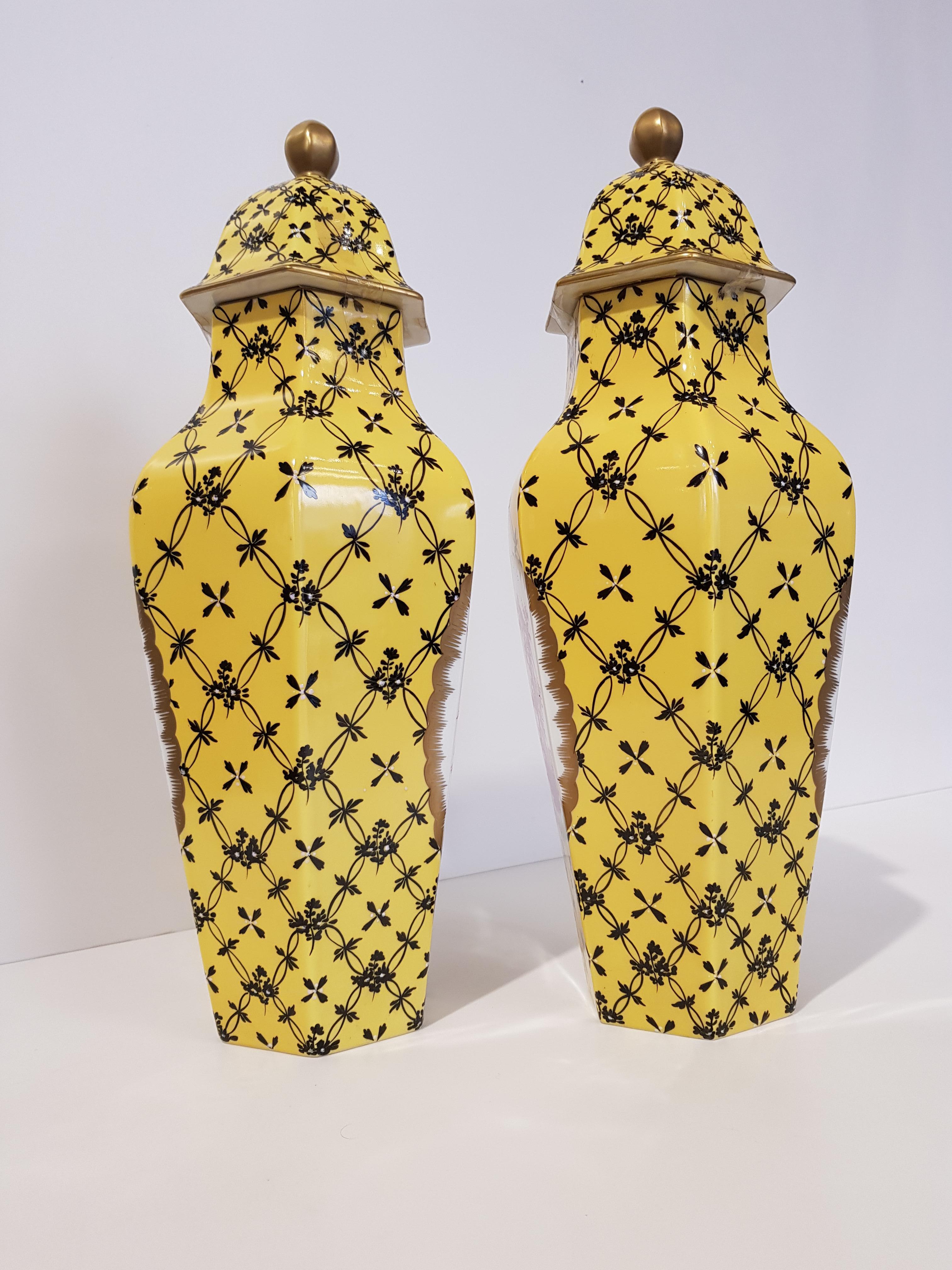 Pair of Baroque Style Black and Yellow German Vases with Floral Pattern, 1965

Pair of German porcelain vases from Dresden.
These vases are finely hand painted with particular floral / geometric motifs in black that stand out against the particular
