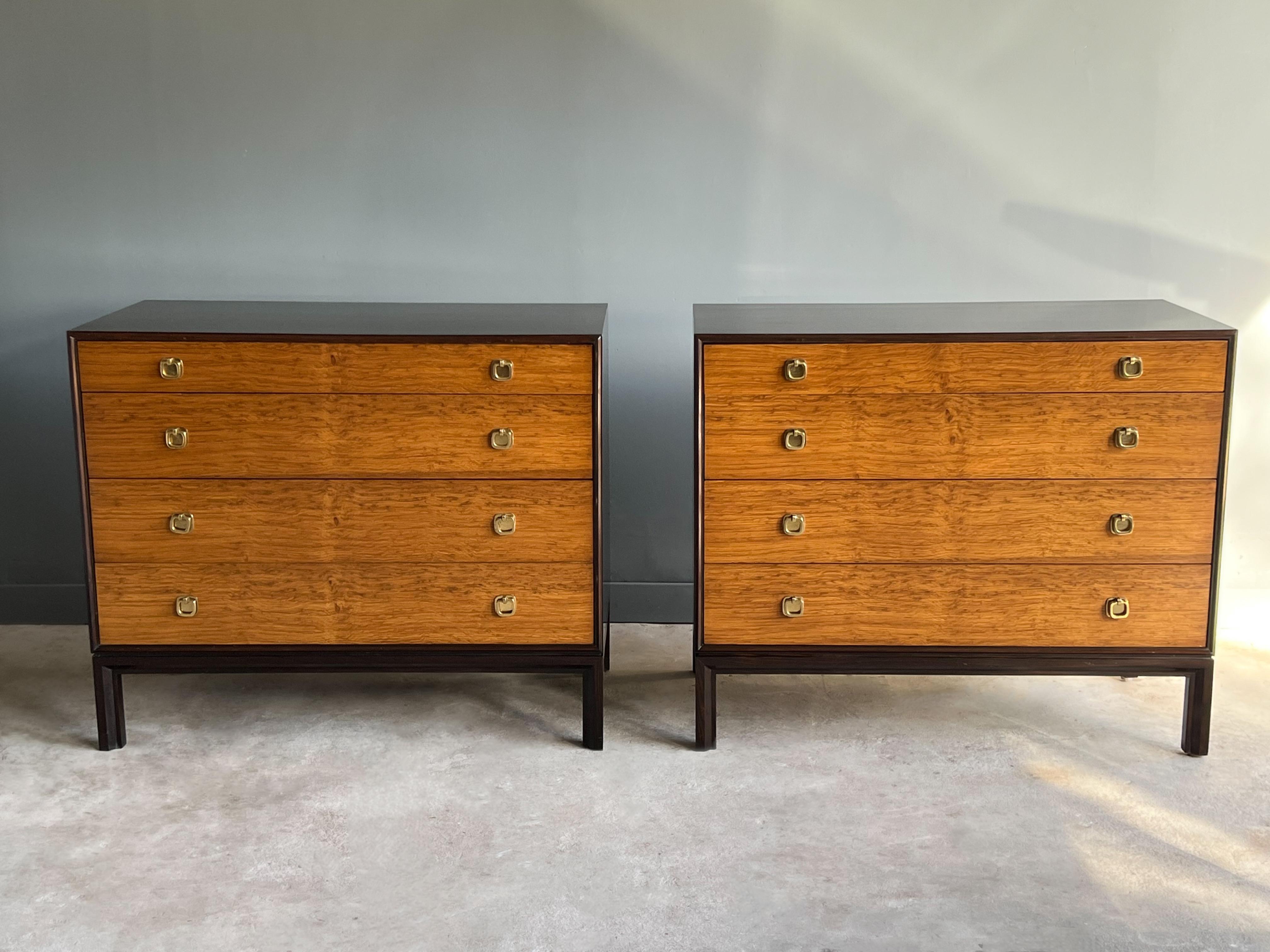 Pair of dresser chests designed by Edward Wormley for Dunbar Furniture, c. 1960s. Model 6720 features a stained ash outer case, solid rosewood edges and English oak drawer fronts with solid brass “H” pulls. Wonderful grain flairs on drawers. It’s
