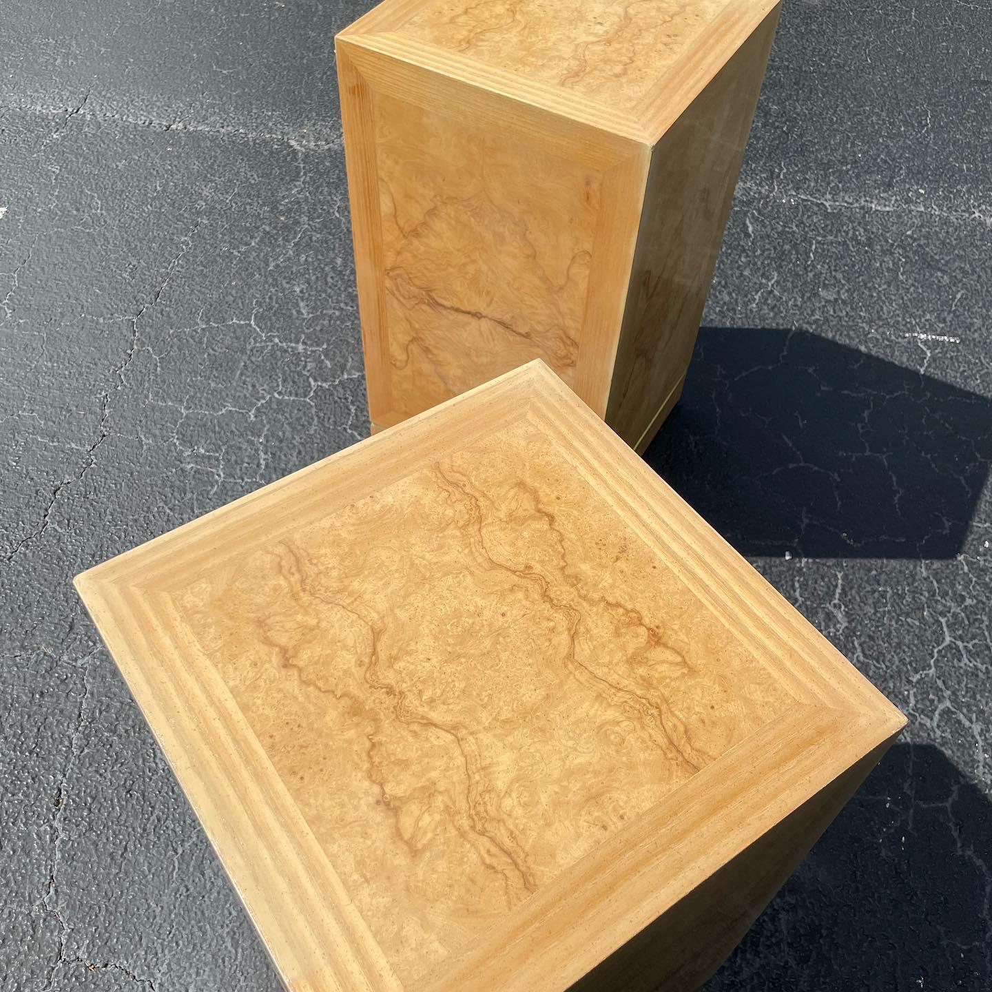 Pair of Vintage Drexel Heritage burl wood and brass pedestal table bases
This duo is comprised of real burl wood inlay throughout. They can be combined as a dining table base or used separately as pedestals. 

in great vintage condition with