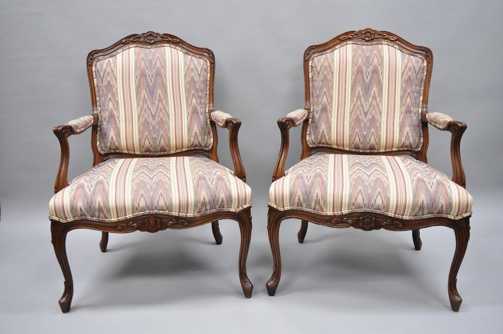 Pair of Drexel heritage French Louis XV style armchairs. Item features purple and beige upholstery, wood construction, upholstered armrests, nicely carved details, original label, cabriole legs, great style and form, circa 1990s. Measurements: 38