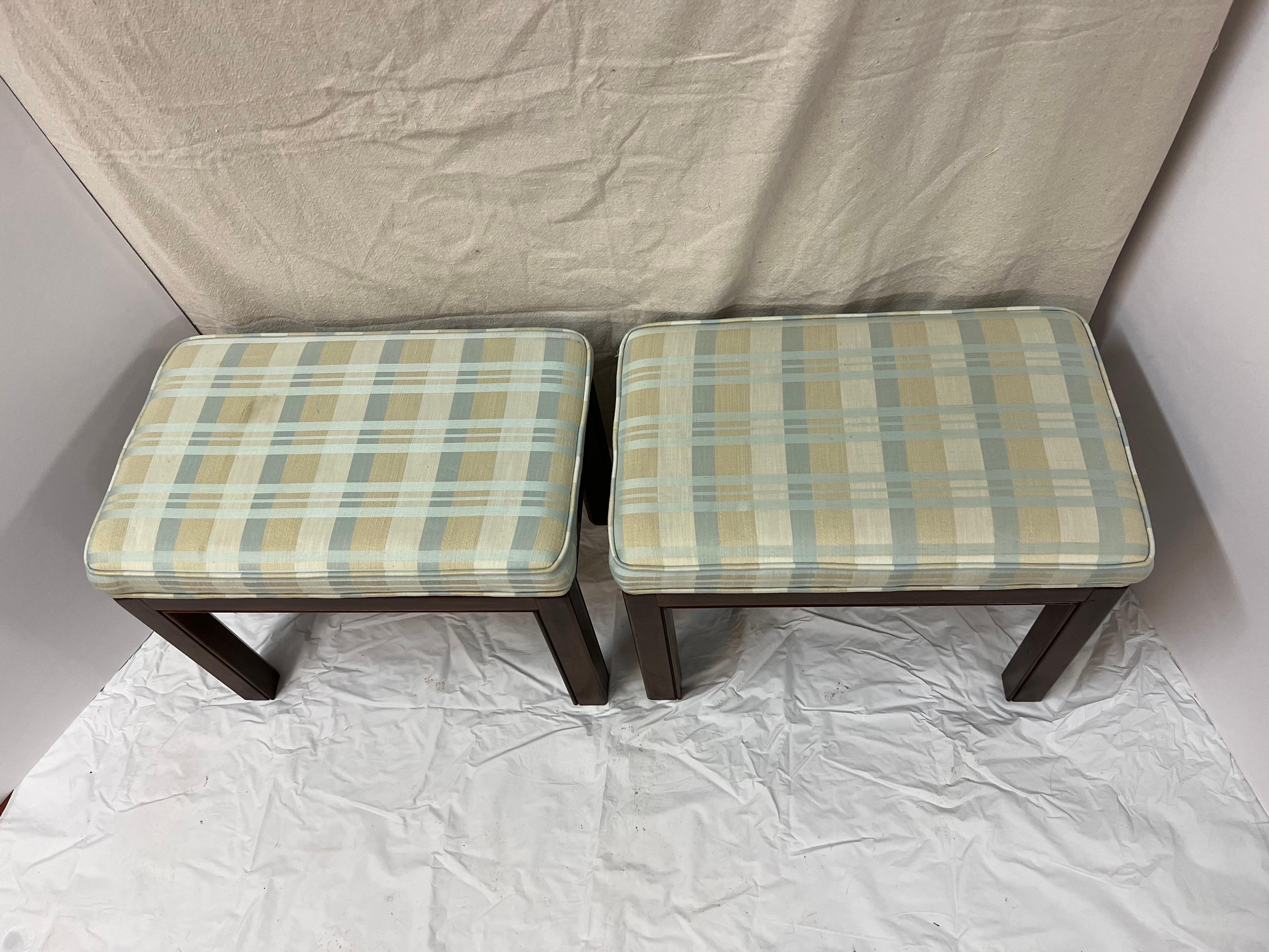 Classic pair of Drexel Heritage Ottomans or Foot Stools. Perfect for under a console or at the end of a bed. Signed and in very good condition. These can parcel ship economically over white glove. Please request a Parcel Quote.