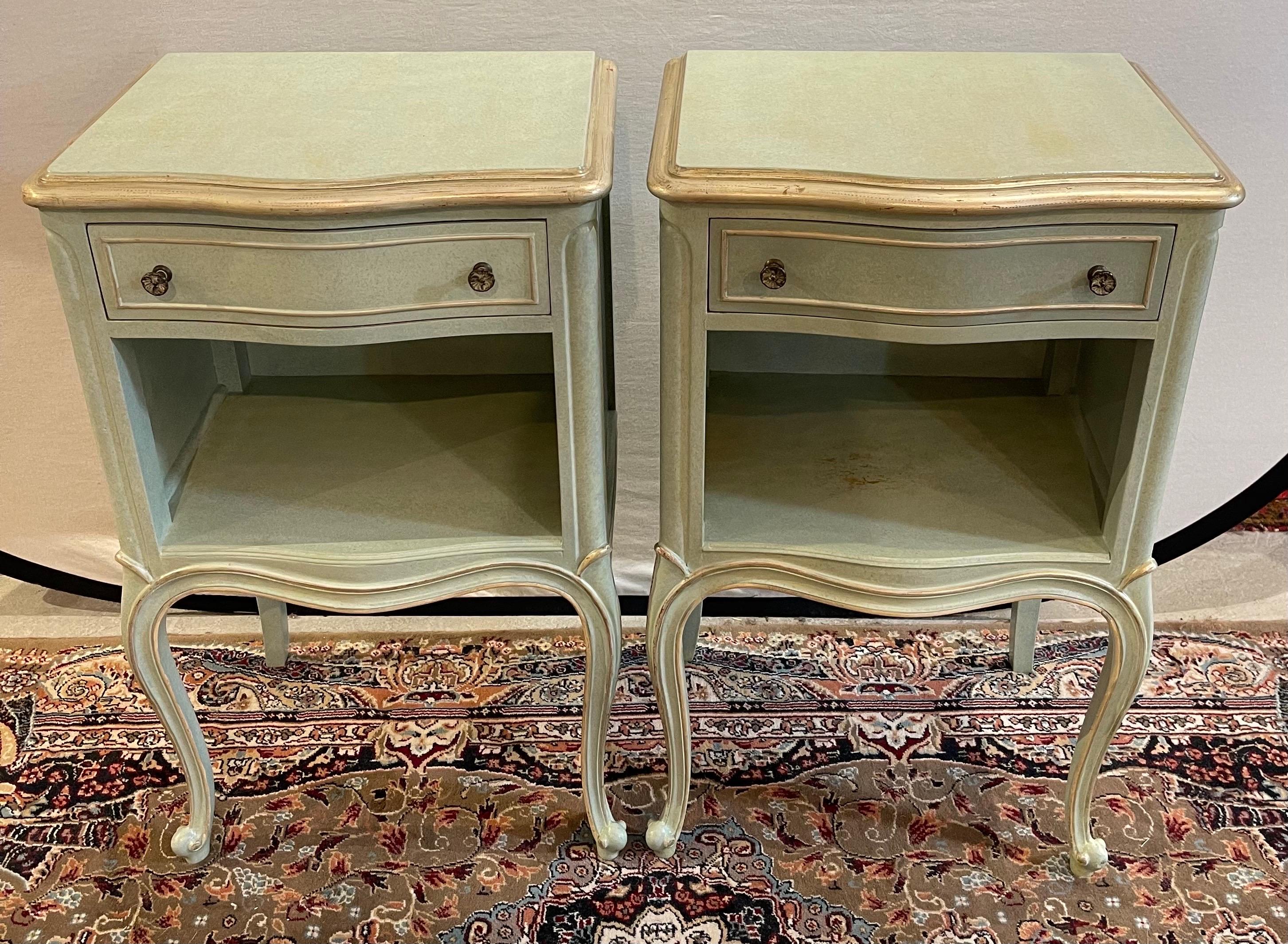Characterized by its sculptural front and graceful curves, these Drexel Touraine French Provincial nightstands showcase the quintessential French Provincial style. The nightstand features a single drawer, perfect for storing bedside essentials, and