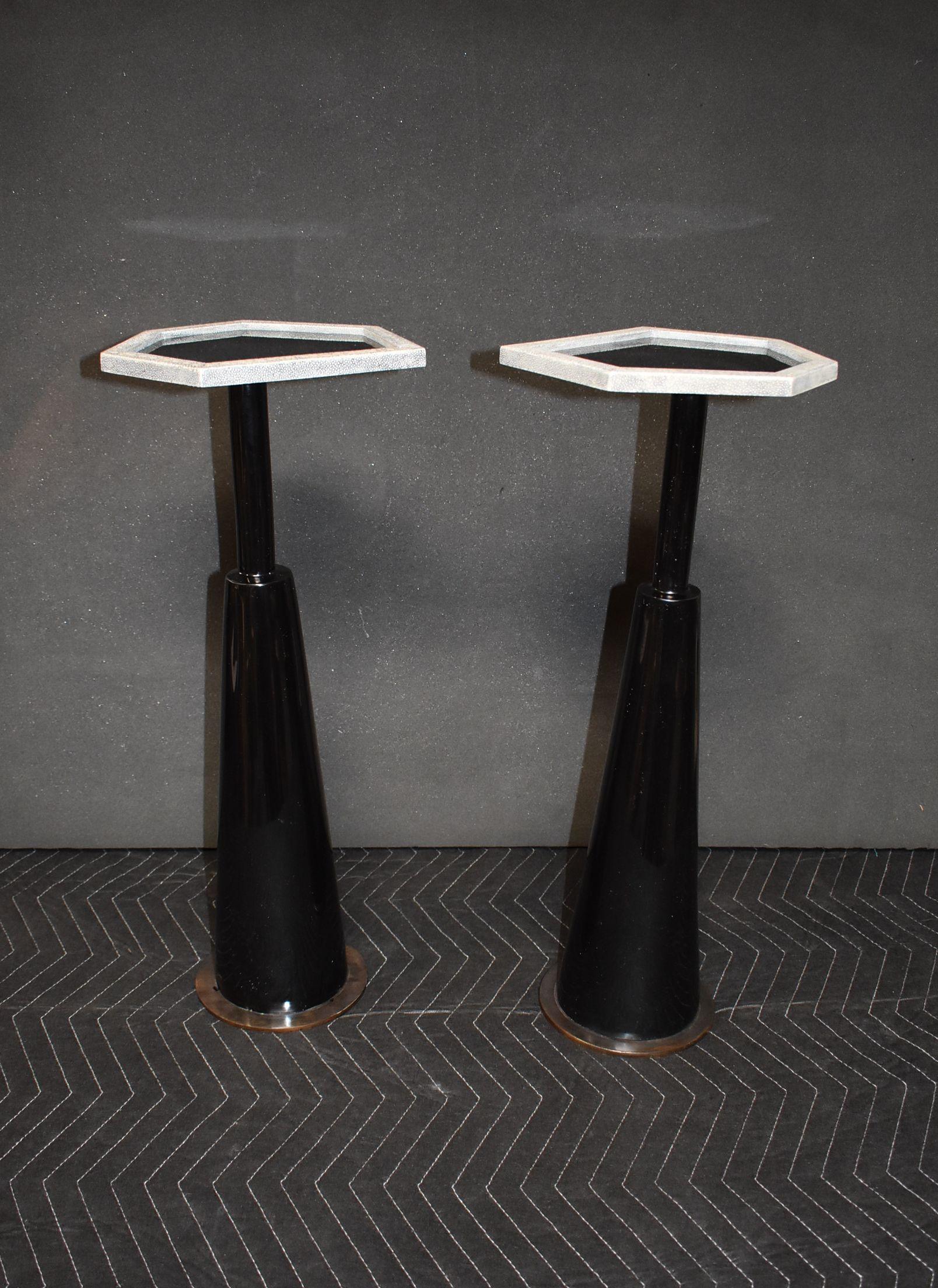 Pair of black resin side tables with trapezoid shape top and grey shagreen trim.
Round metal base with bronze patina finish.
Dimension of base: Diameter 6.5