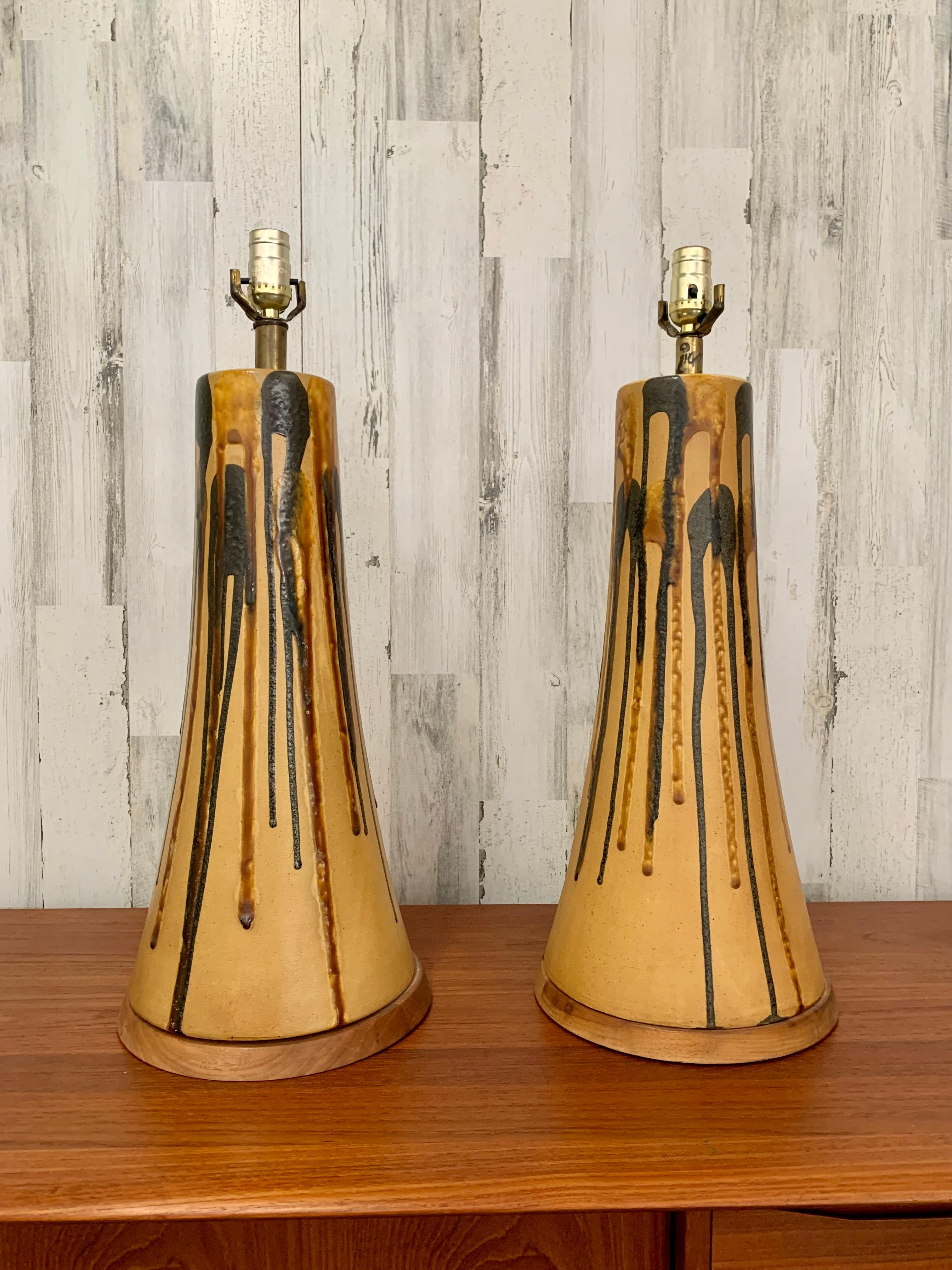 Mid century Ochre with charcoal and amber drip glaze ceramic lamps.