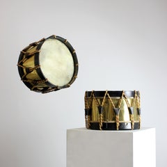 Pair of drums with skin heads, gilt brass shells, black lacquered wooden crowns