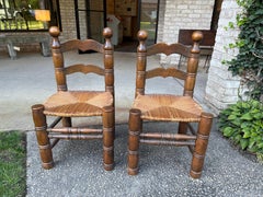 Pair of Dudouyt Fireside Oak Chairs w/ Thatch Seats