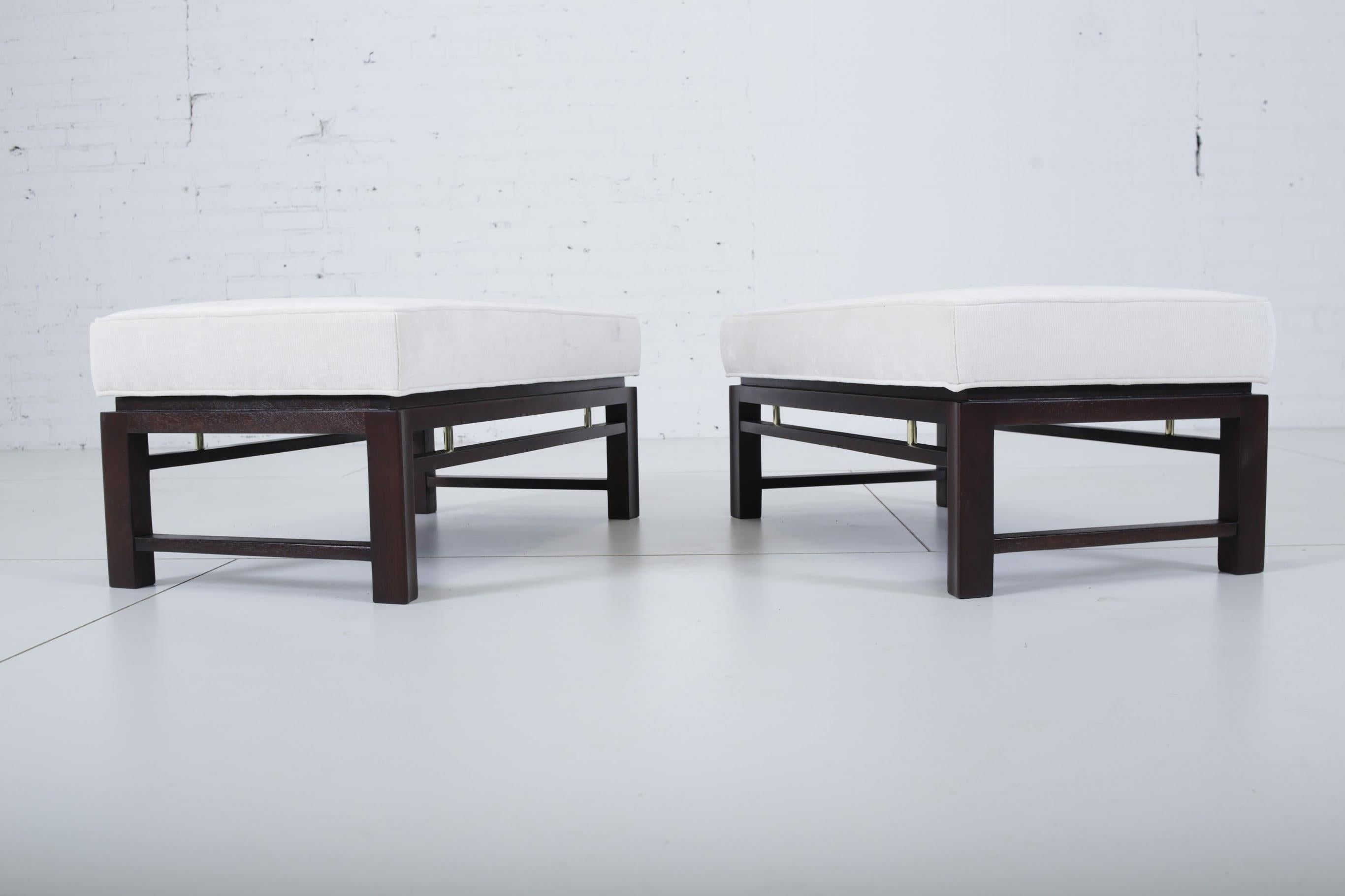 Pair of benches by Edward Wormley for Dunbar. Fully restored mahogany bases with brass accents and new upholstery.