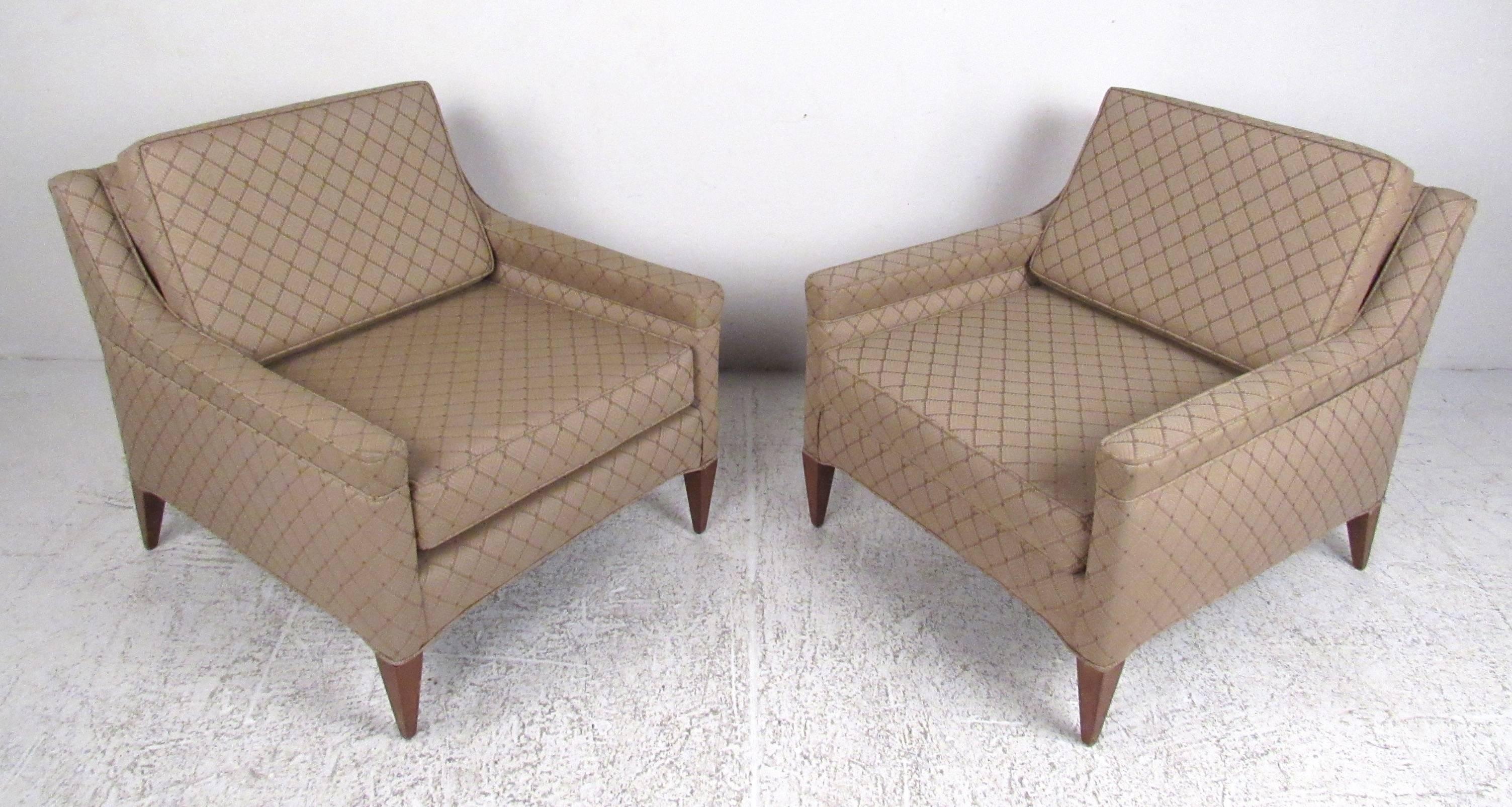 Nice pair of sloped arm lounge chairs attributed to Edward Wormley for Dunbar. Very comfortable with a lower profile and a wide, deep seat. Original metal Dunbar tag attached. Please confirm item location (NY or NJ) with dealer.