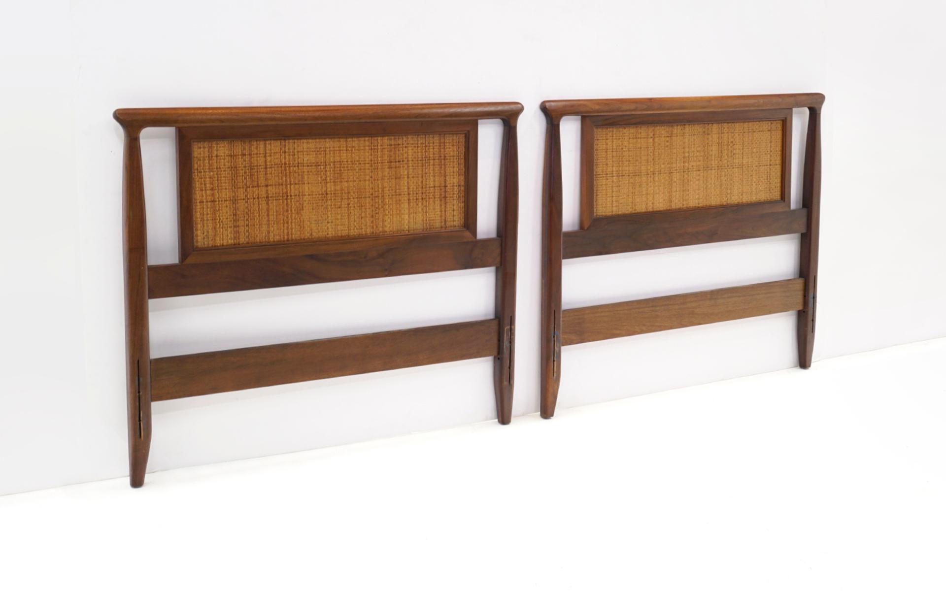 Two beautifully crafted sculptural single headboards designed by Edward Wormley for Dunbar, 1950s.  These are in very good original condition from the single original owner.  Very few signs of. use.  No breaks or repairs to the cane.  Ready to use.