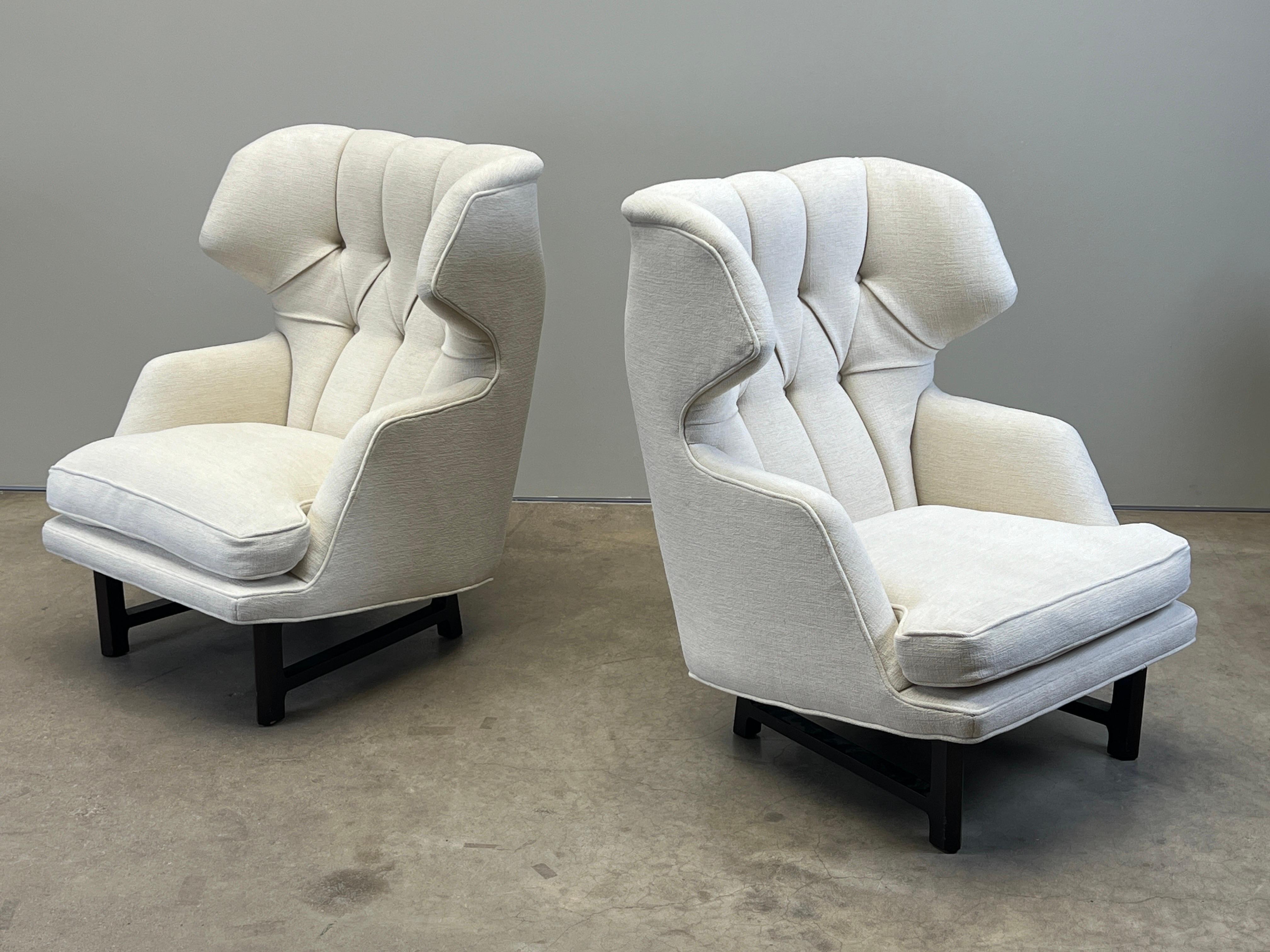 A pair of wing back Janus lounge chairs designed by Edward Wormley for Dunbar. Newer restoration in very good condition. 