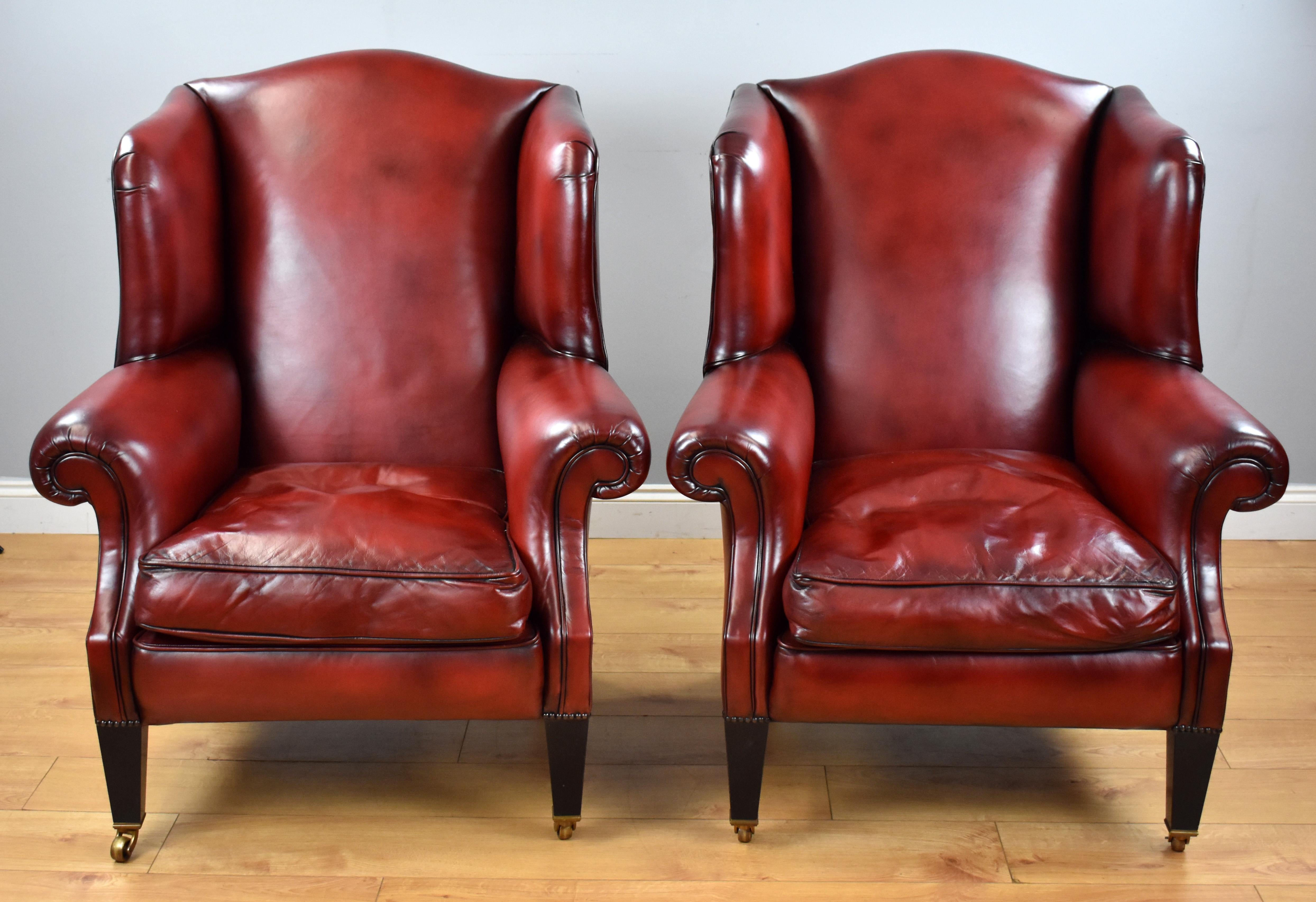 For sale is a good quality pair of Durester hand dyed leather wing back armchairs, both in very good condition.

  