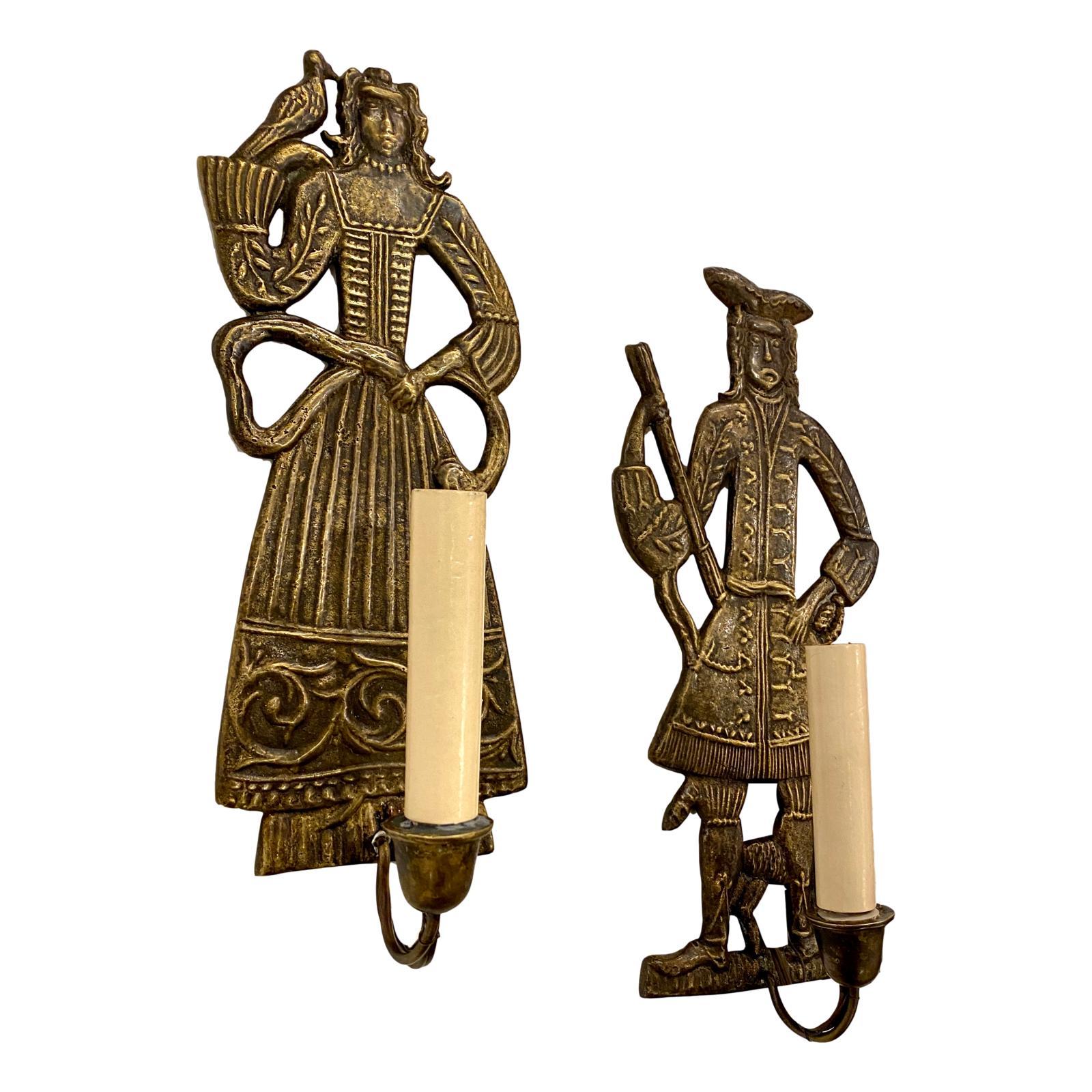 Pair of circa 1940s Dutch cast and patinated bronze figural sconces with original patina.

Measurements:
Height 12