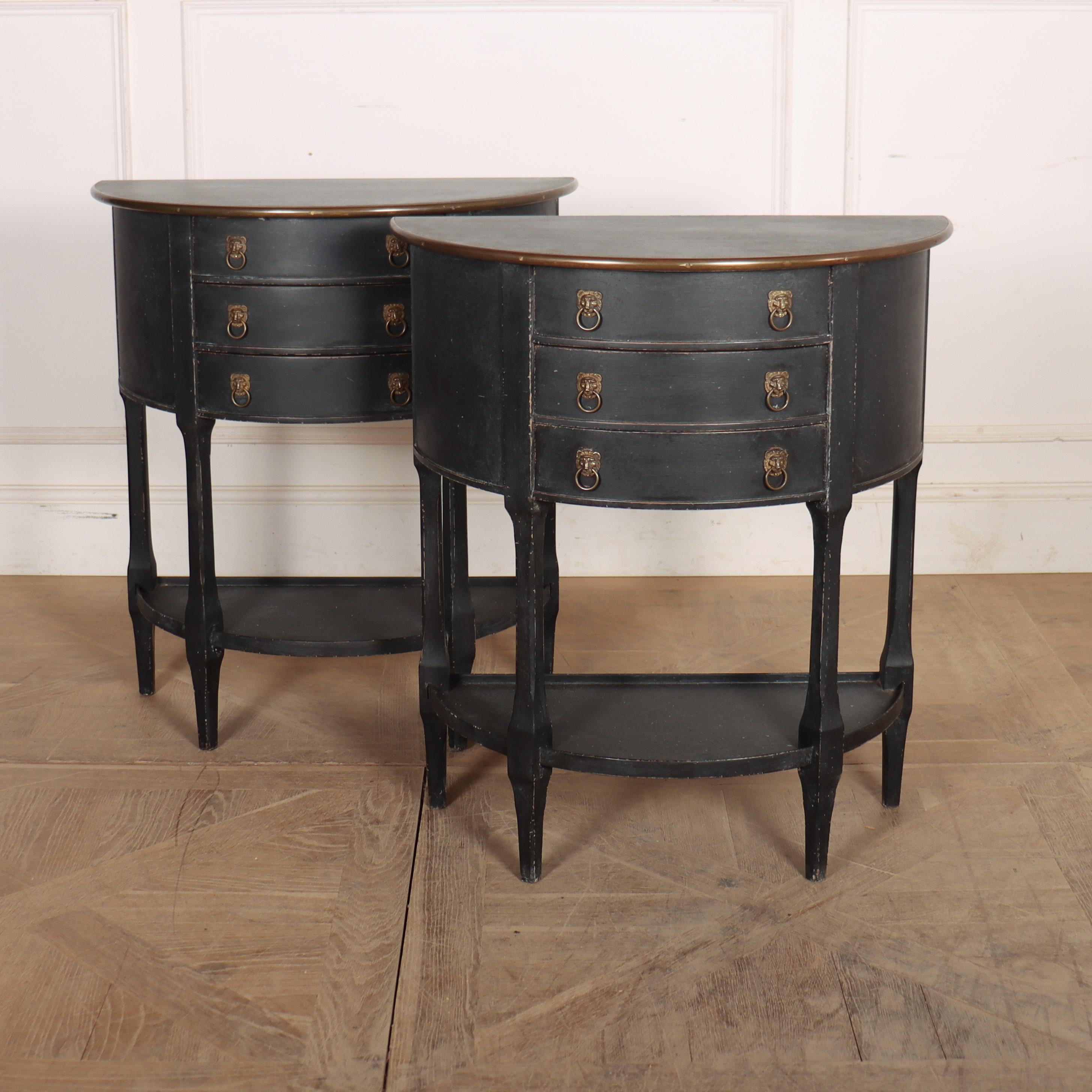 Good quality pair of 20th Century Dutch demi-lune console tables/ bedside tables. Finished in a mottled black paint and decorative brass trim. 