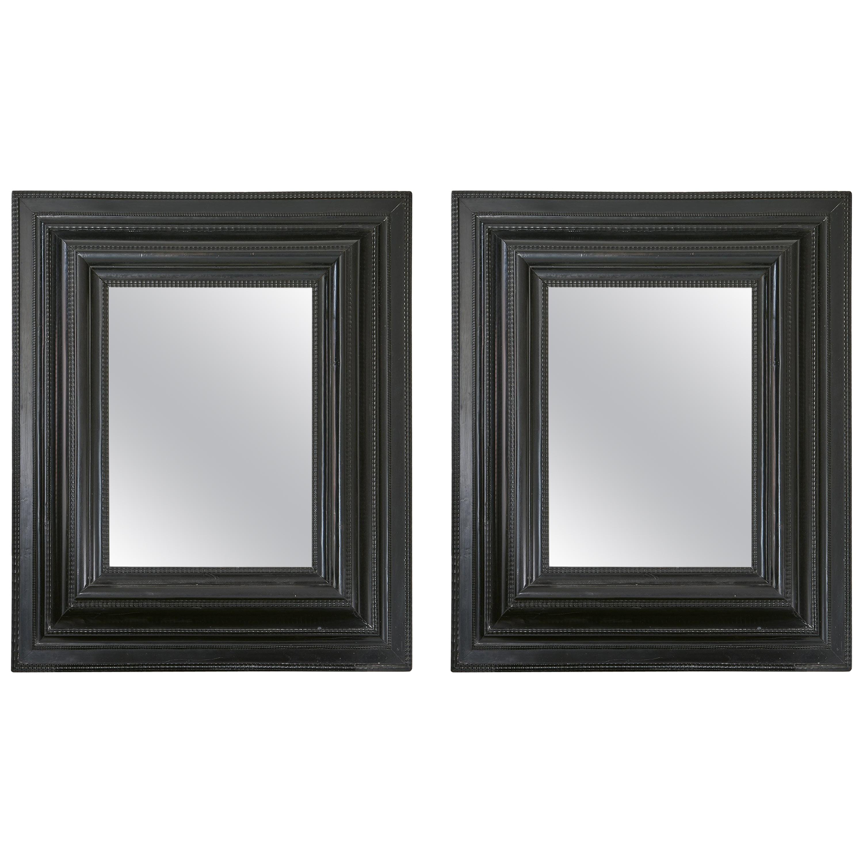 Pair of Dutch Ebonized Cushion Frame Mirrors For Sale