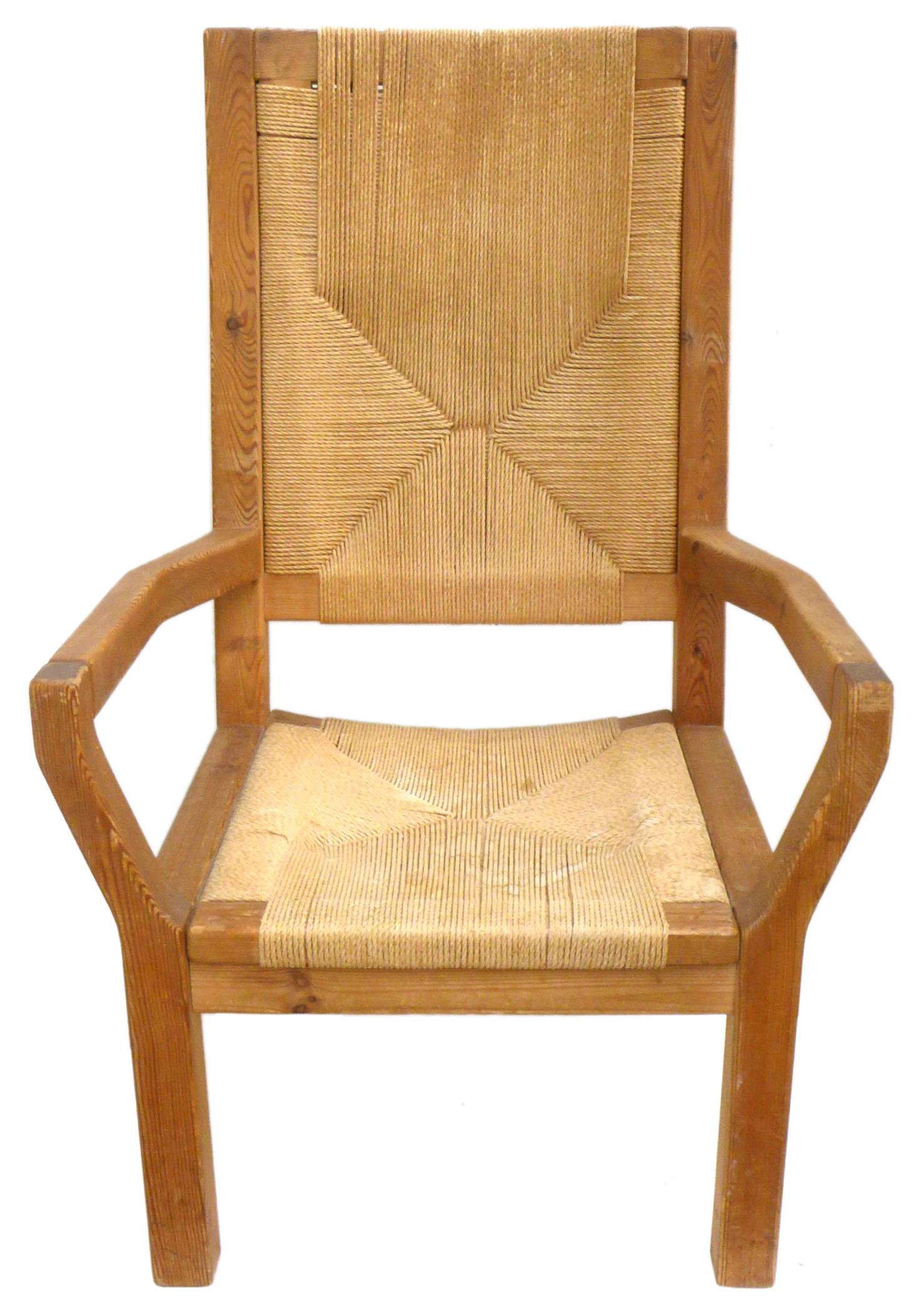 A fantastic pair of Dutch, wood and woven-twine highback armchairs. Handsome, well-built forms with unexpected angles, wonderful woodgrain, and an ample, comfortable seating area. Great, impressive scale and proportions; a classic mix of materials