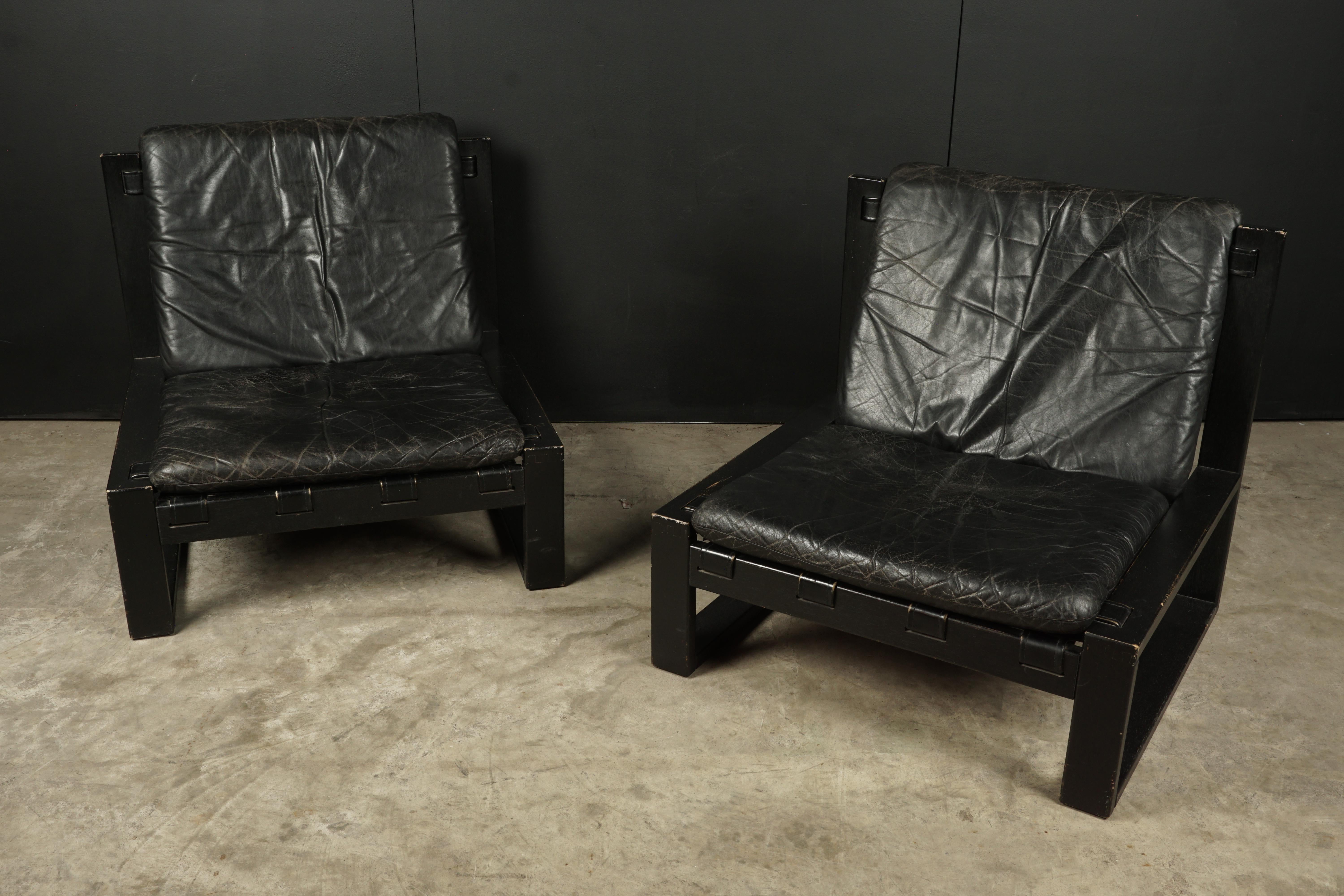 Pair of Dutch midcentury lounge chairs by Sonja Wasseur, Netherlands, 1970s. Black lacquered wooden frames with original black leather cushions.