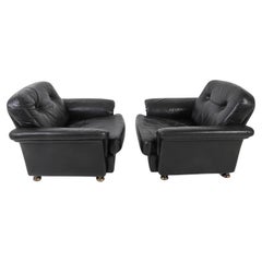 Pair of dutch mid century modern tufted black leather low lounge chairs