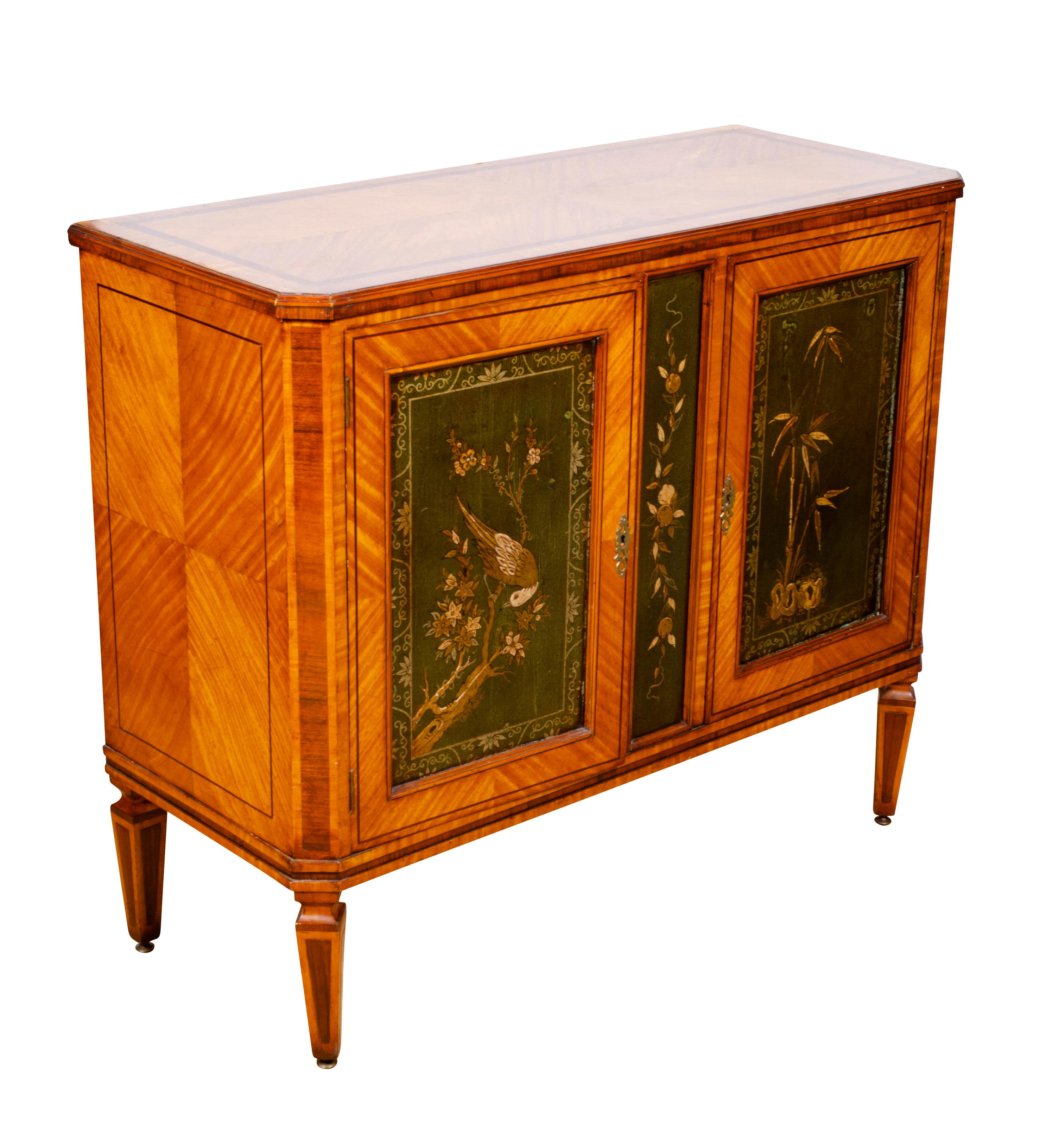 Each with rectangular tops with rosewood banding, canted corners over a pair of doors each with green 
chinoiserie decorated doors and dividers. One shelf. Raised on square tapered legs.