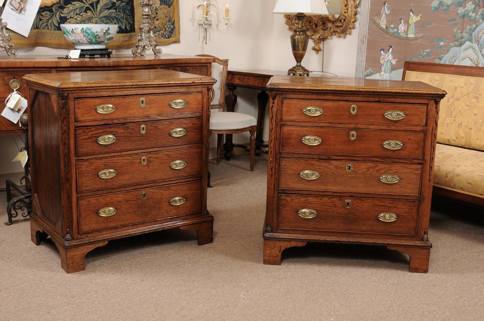 A pair of late 18th century Dutch commodes with canted carved corners, 4 graduating drawers with brass pulls ending in bracket feet.

   