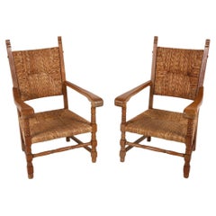 Pareja de sillones de comedor de roble holandés y junco, circa años 50