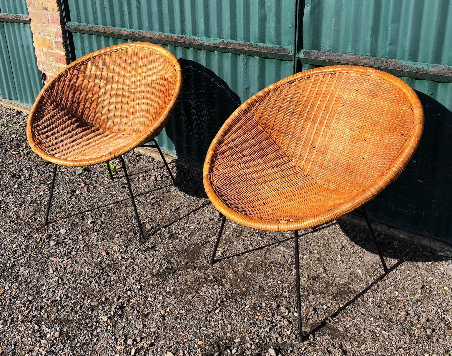 Pair of Dutch rattan and metal tub / satellite chairs, Rohe Noordwolde, 1960s

An iconic design, very typically 1960s these beautiful satellite tub chairs believed by be designed by Dirk Van Sliedrecht, for Rohe Noordwolde 
in the Netherlands 1960s.