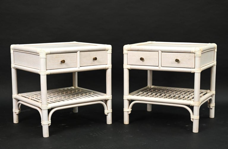 A charming pair of Palm Beach style whitewashed rattan two-drawer end tables or nightstands by DUX.