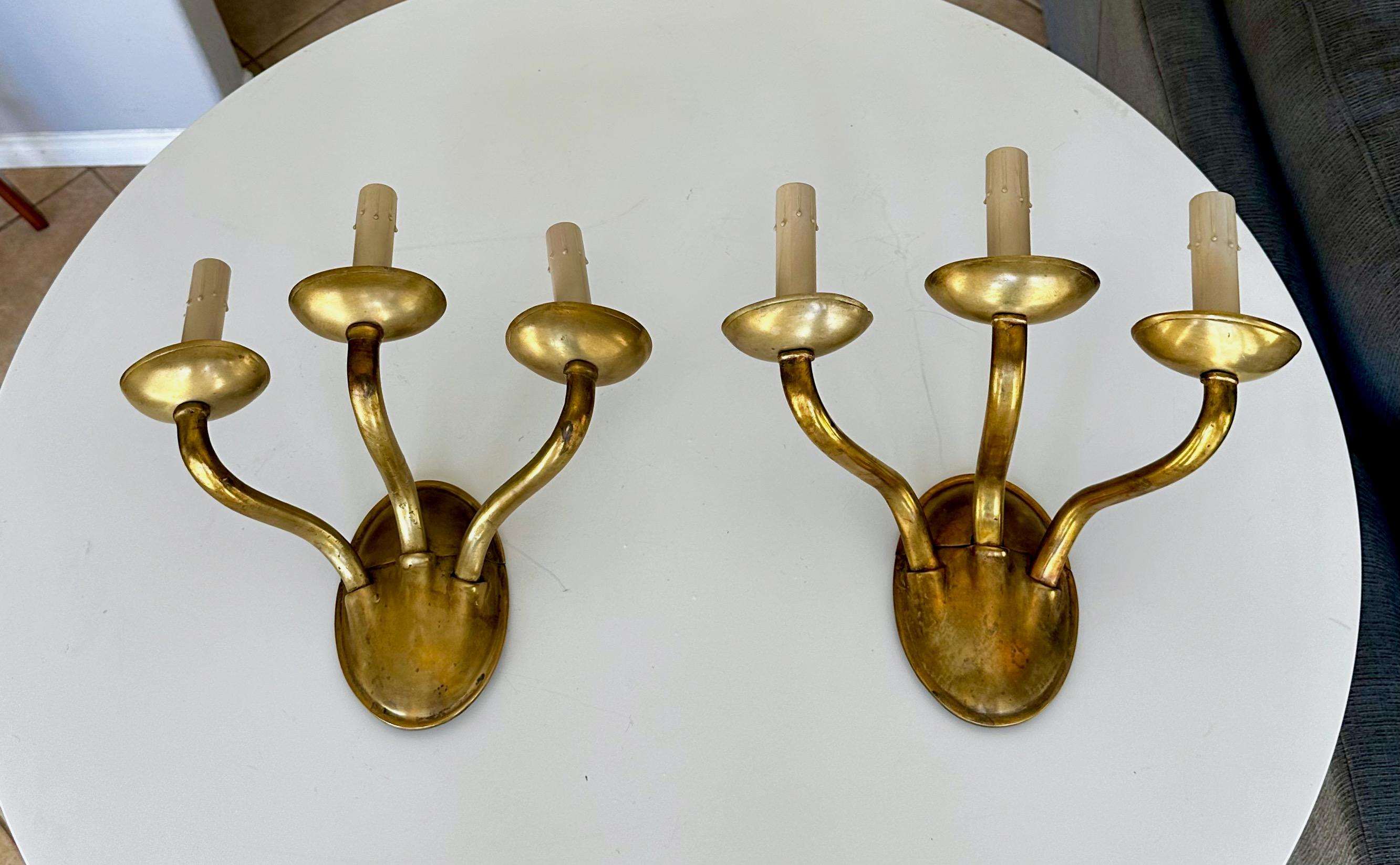 American Pair of E F Caldwell Arts & Crafts Three-Arm Brass Wall Sconces For Sale