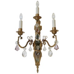Pair of E. F. Caldwell Gilt Wrought Iron, Mirror and Crystal Sconces