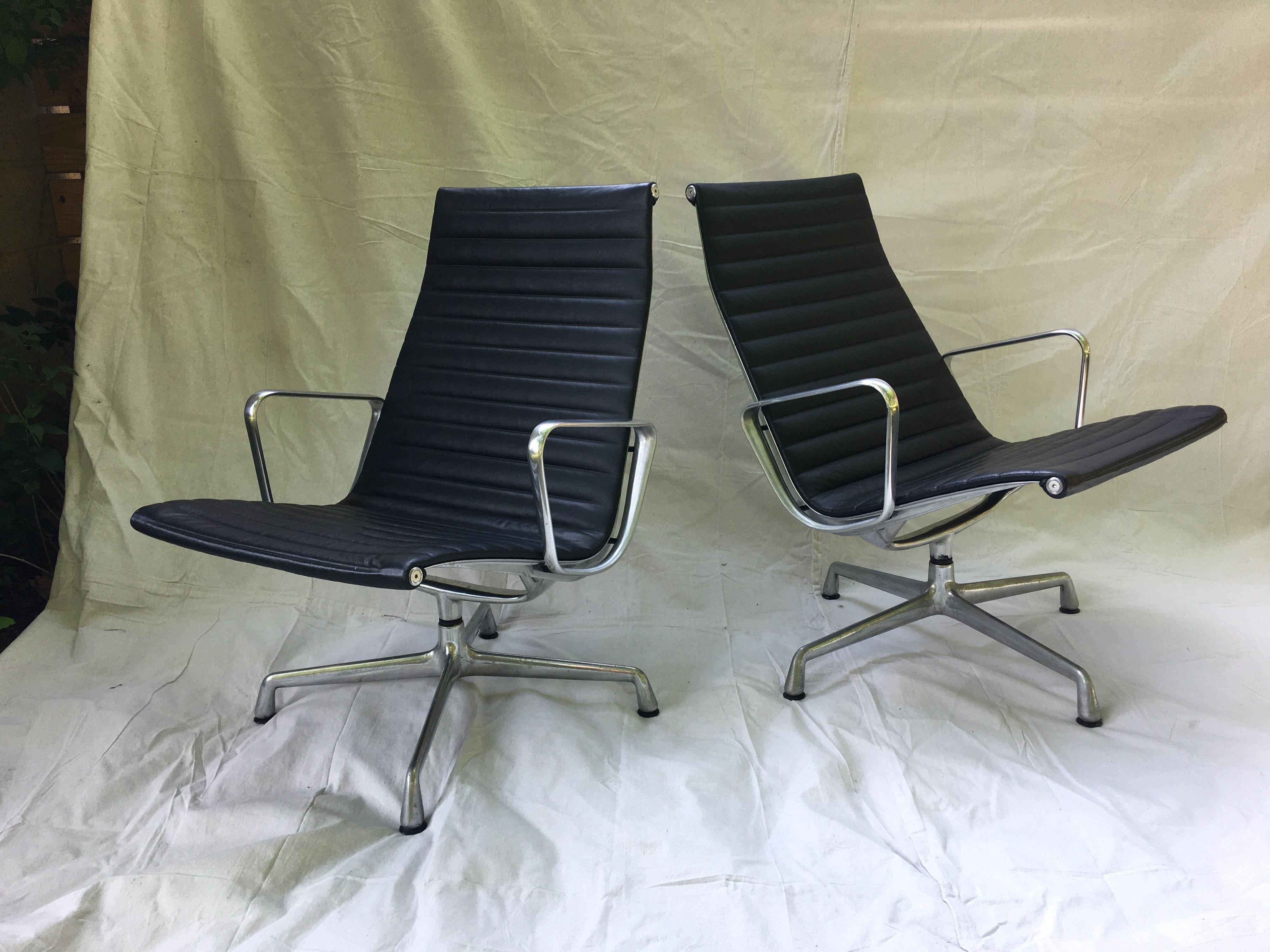 Pair of Eames aluminum group leather lounge chairs. Very nice to find a pair in Leather, usually fabric or vinyl! Very clean with minimal wear! Very comfy, chairs swivel, aluminum arms are clean showing minimal wear.