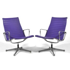 Pair of Eames Aluminum Group Lounge Chairs by Herman Miller Purple
