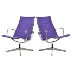 Pair of Eames Aluminum Group Lounge Chairs by Herman Miller Purple