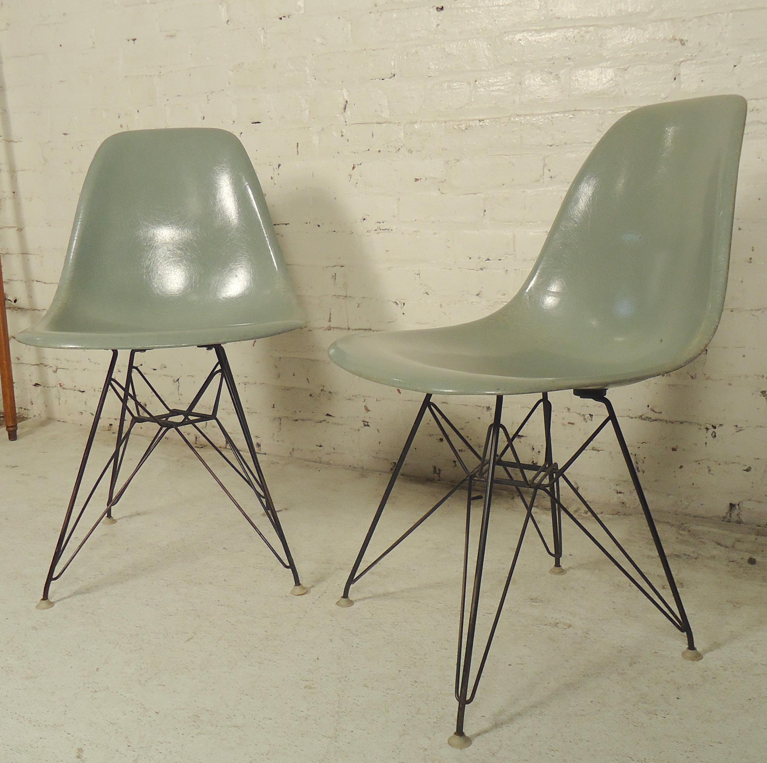 Mid-Century Modern molded plastic shells with strong polished metal bases.
(Please confirm item location - NY or NJ - with dealer)..
  